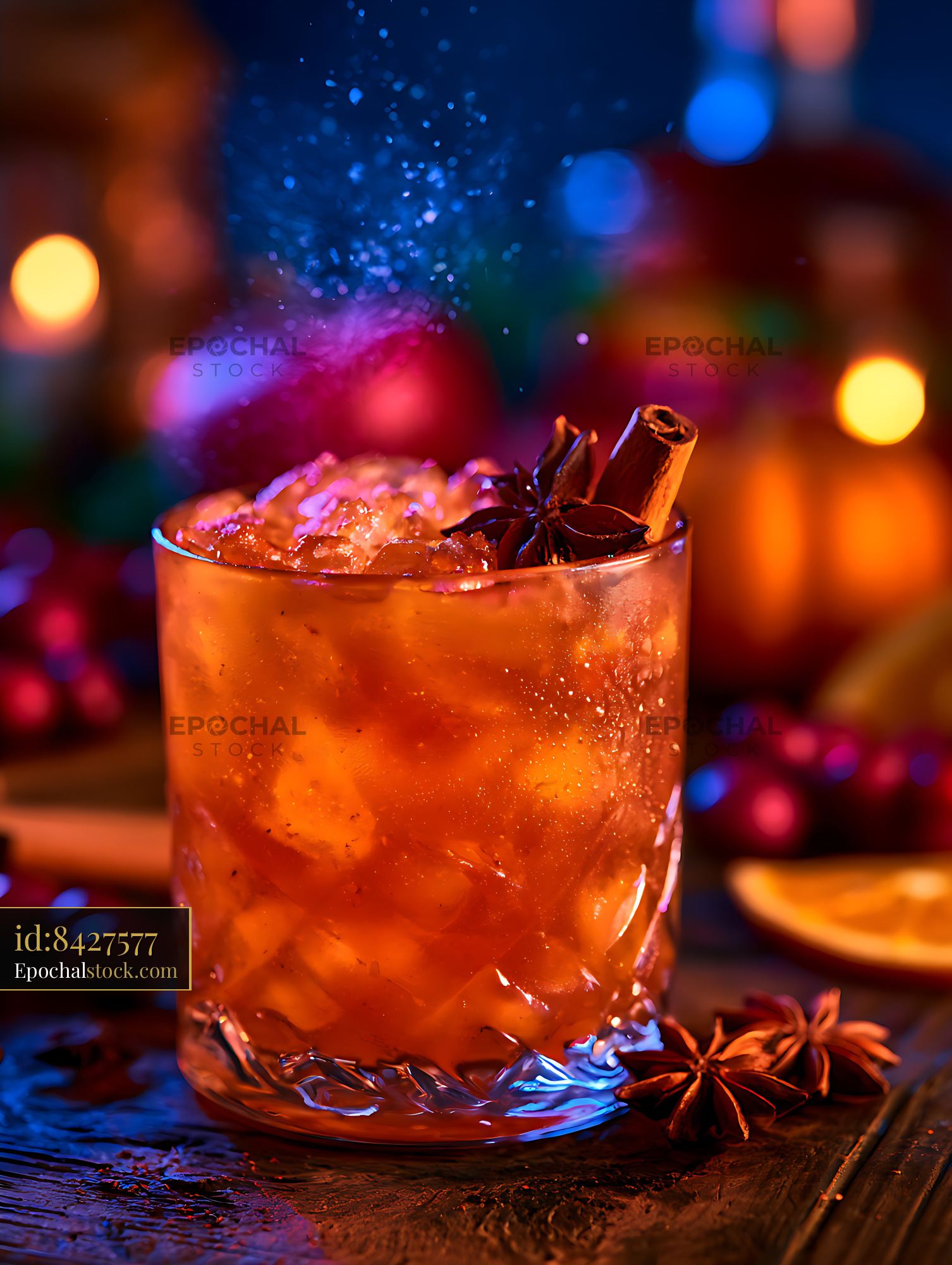 Watermarked full-resolution preview of Orange iced cocktail garnished with spices and colorful lights