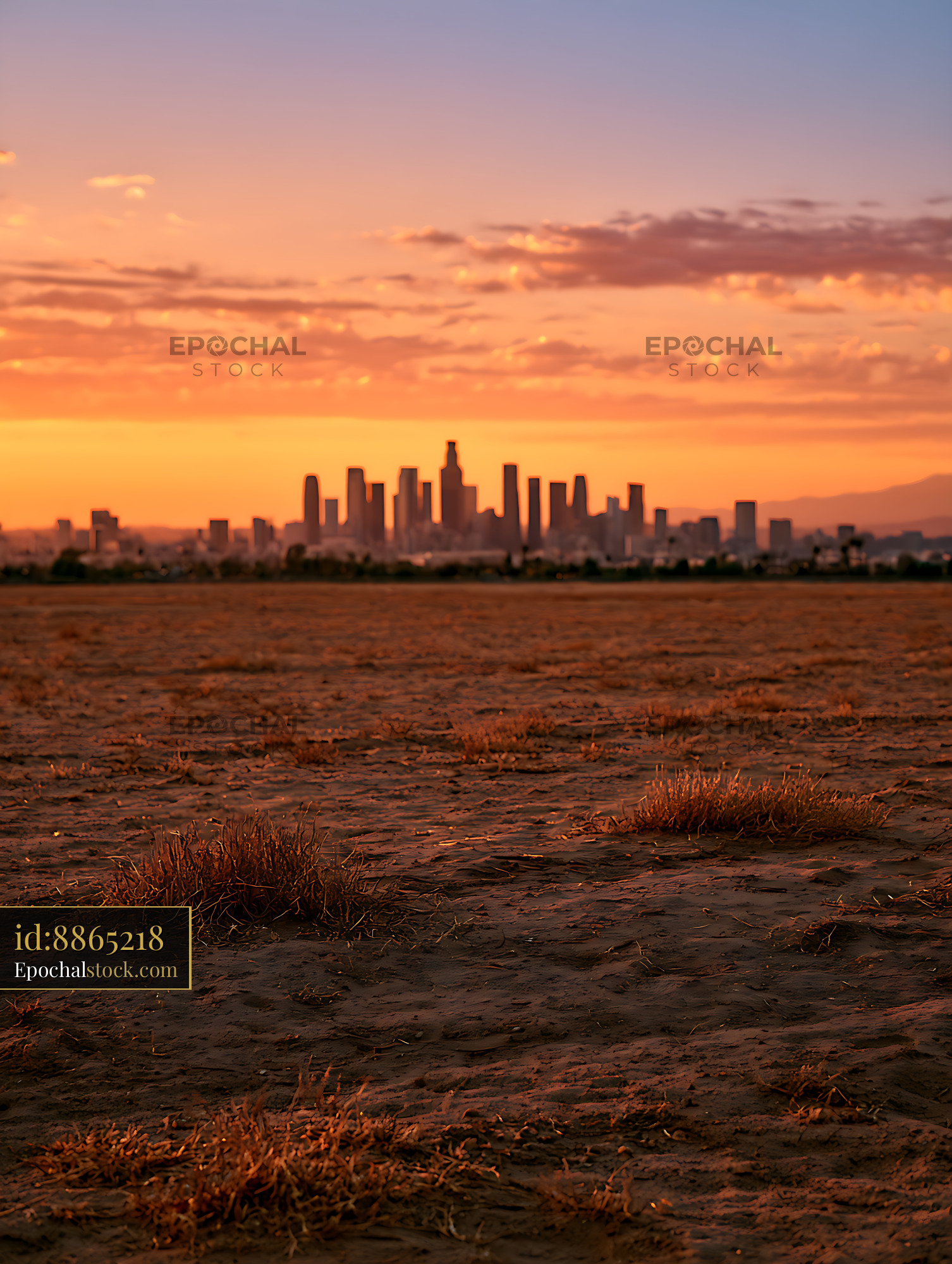 Watermarked full-resolution preview of Distant city skyline under a warm sunset sky