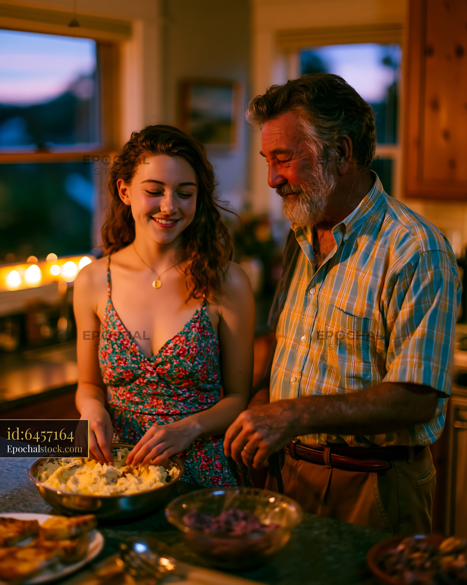 Grandfather and Granddaughter Baking Together in Kitchen at Sunset - stock photo