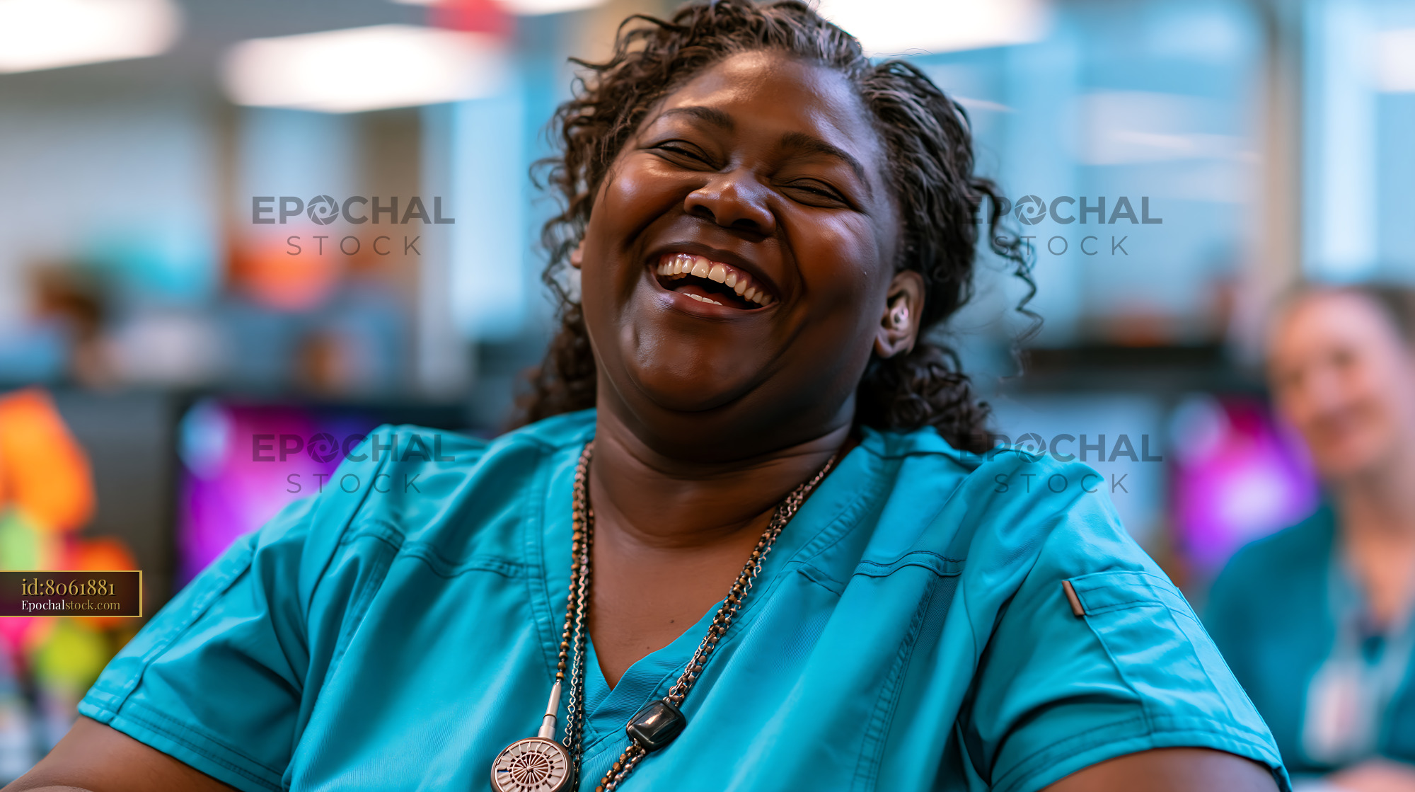 Watermarked full-resolution preview of Happy woman laughing indoors with colorful blurred background