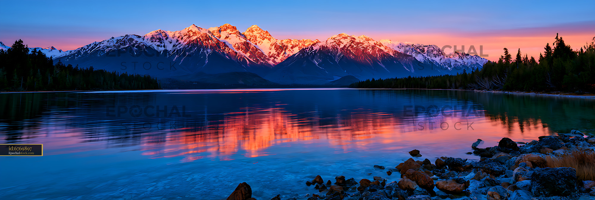 Watermarked full-resolution preview of Sunset reflections of snowy peaks on an alpine lake