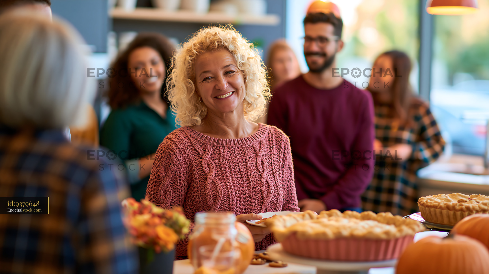 Watermarked full-resolution preview of Happy woman enjoying a festive gathering with friends