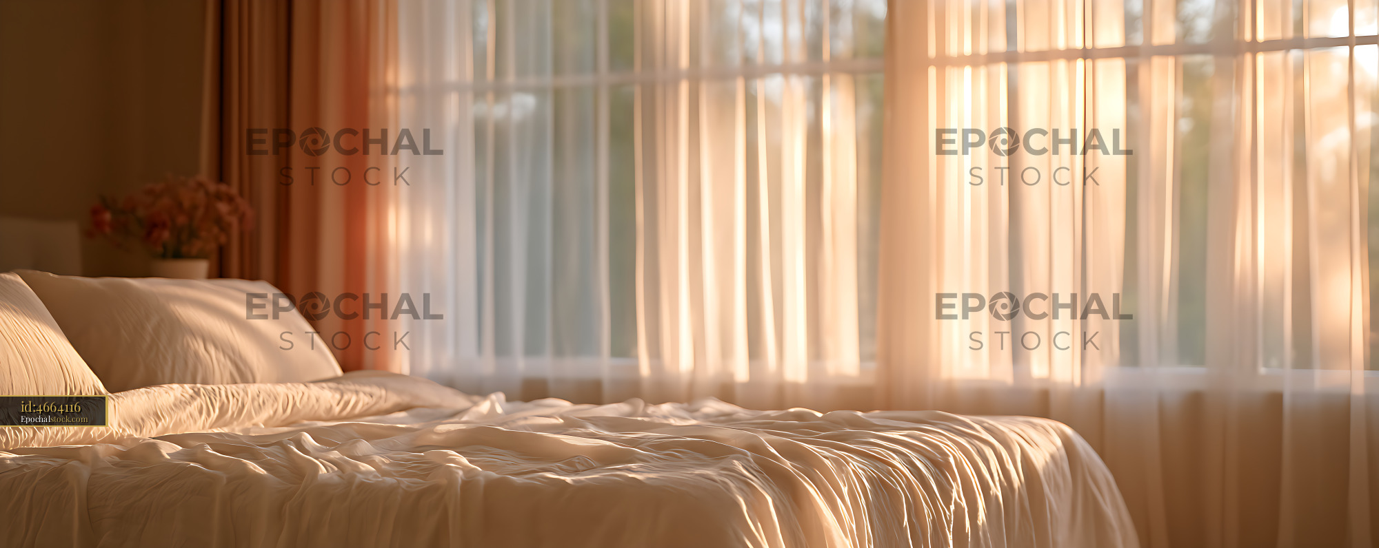 Watermarked full-resolution preview of Warm sunlight across an unmade bedroom bed