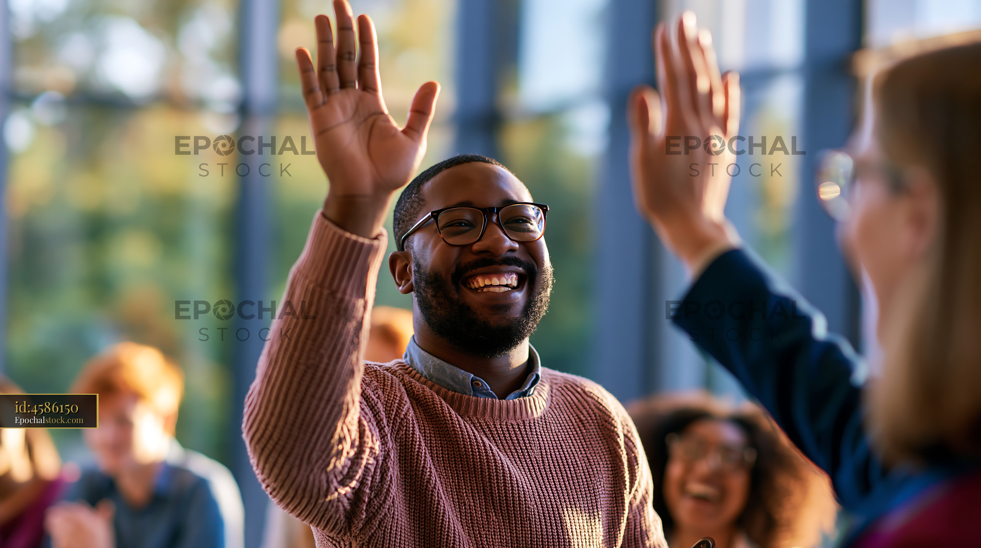 Laughing Student High-Fiving at a Classroom Event in Autumn - stock photo
