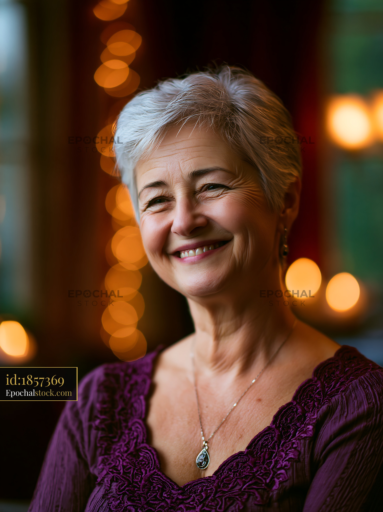 Watermarked full-resolution preview of Smiling elderly woman in soft lighting with blurred background