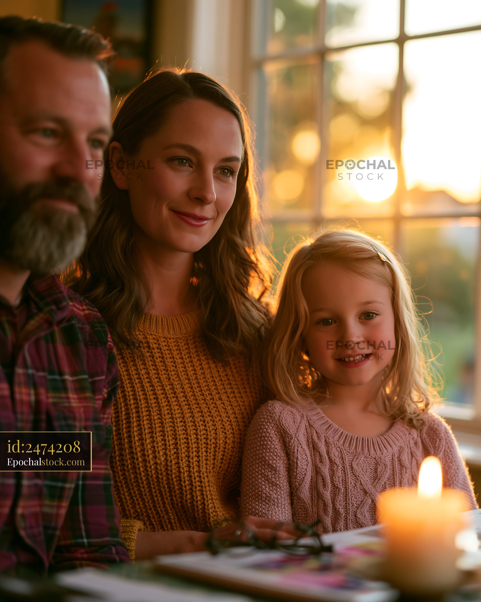 Family Comparing Insurance Offers at Sunset With Candlelight - stock photo