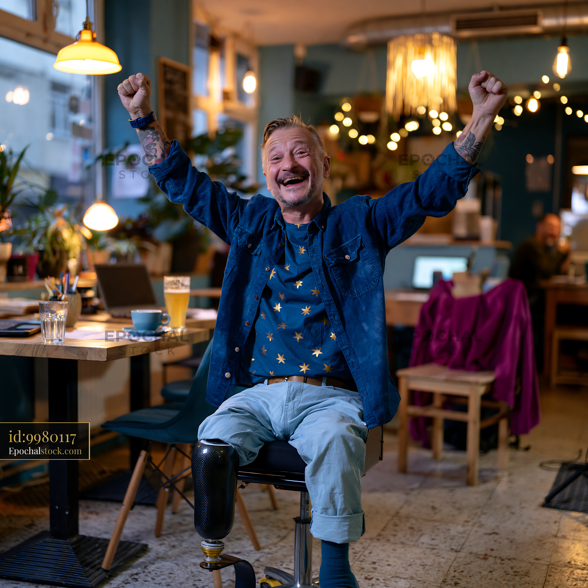 Cheerful Man With a Prosthetic Leg Celebrating in a Cozy Café - stock photo