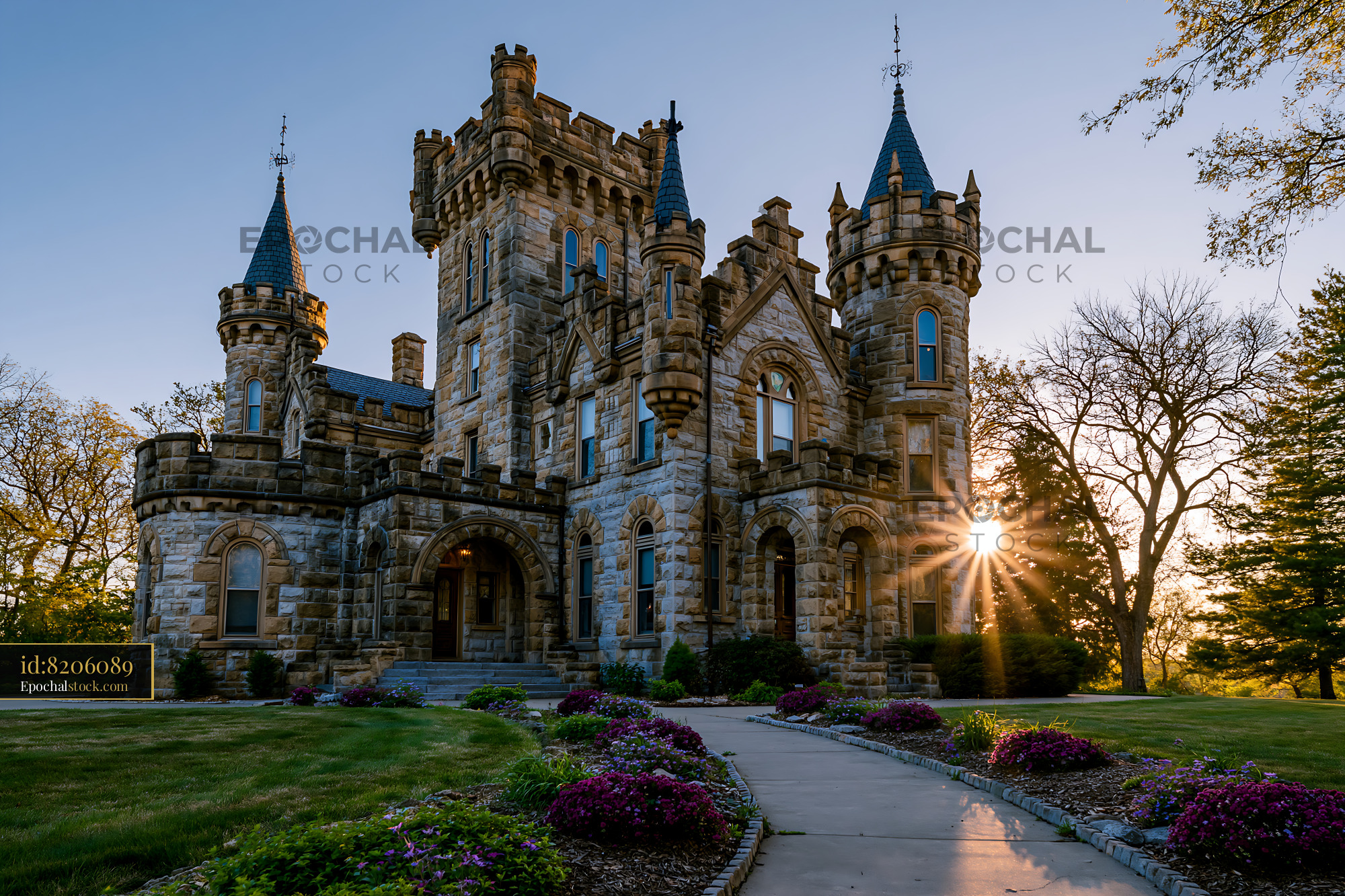 Watermarked full-resolution preview of Historic Gothic stone mansion at golden hour