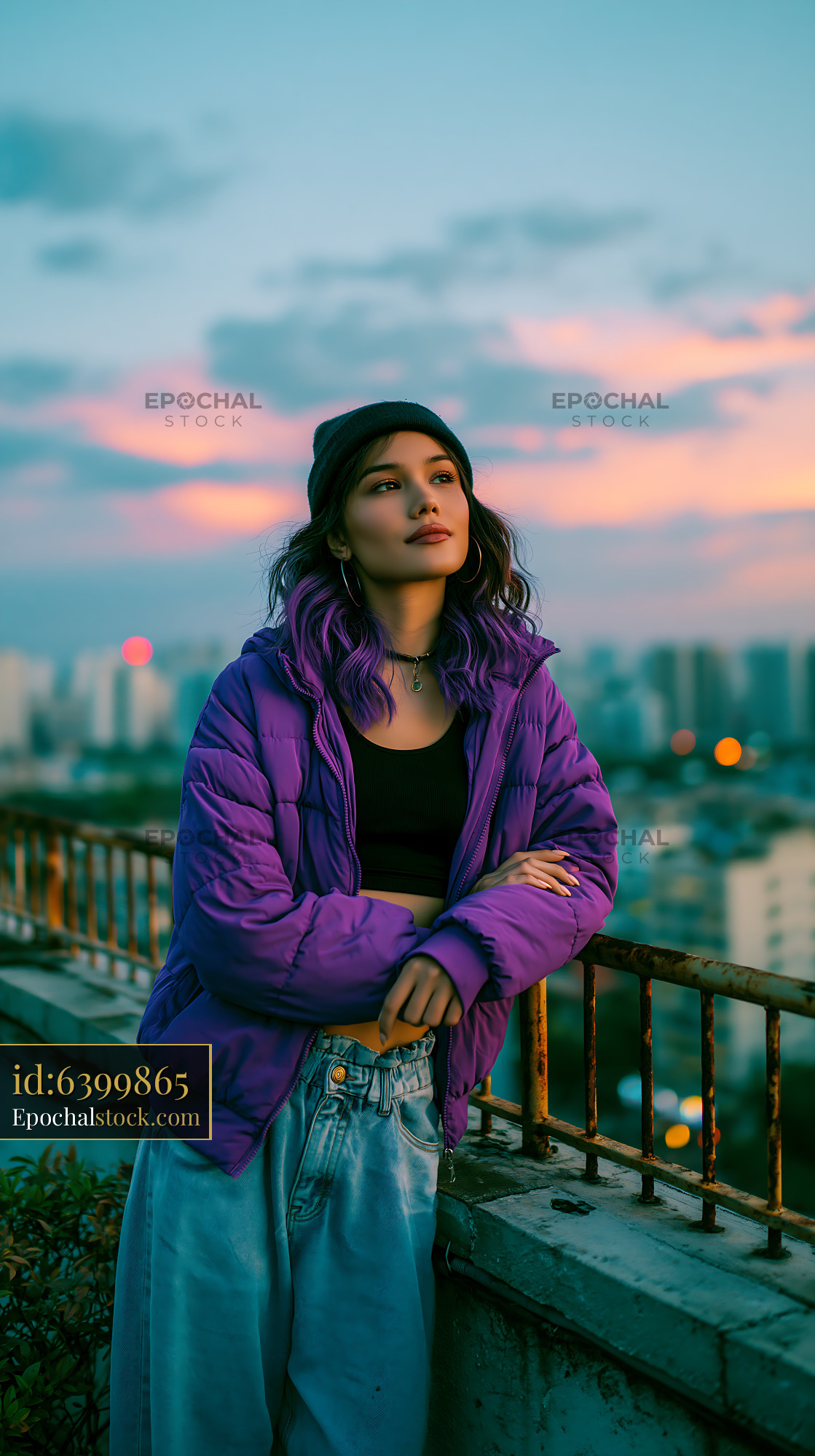 Watermarked full-resolution preview of Young person with purple hair on rooftop at sunset