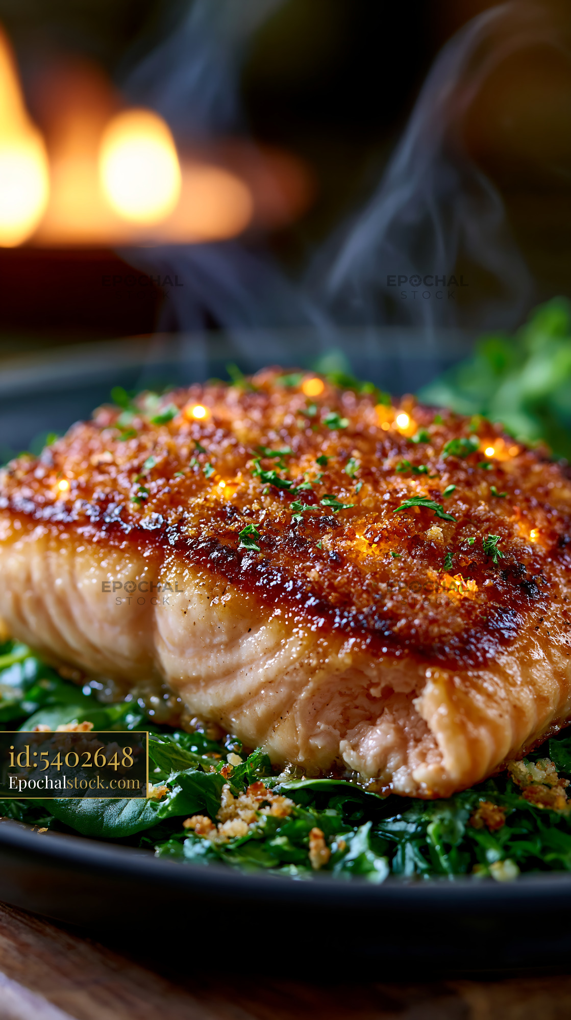 Watermarked full-resolution preview of Salmon fillet served on a bed of greens with steam rising