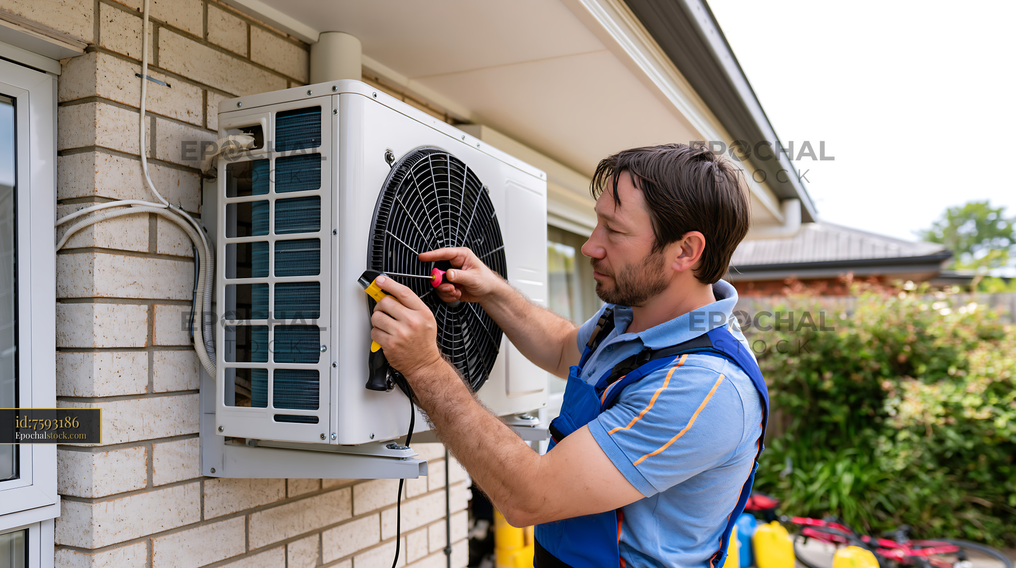 Watermarked full-resolution preview of HVAC technician servicing a residential outdoor unit