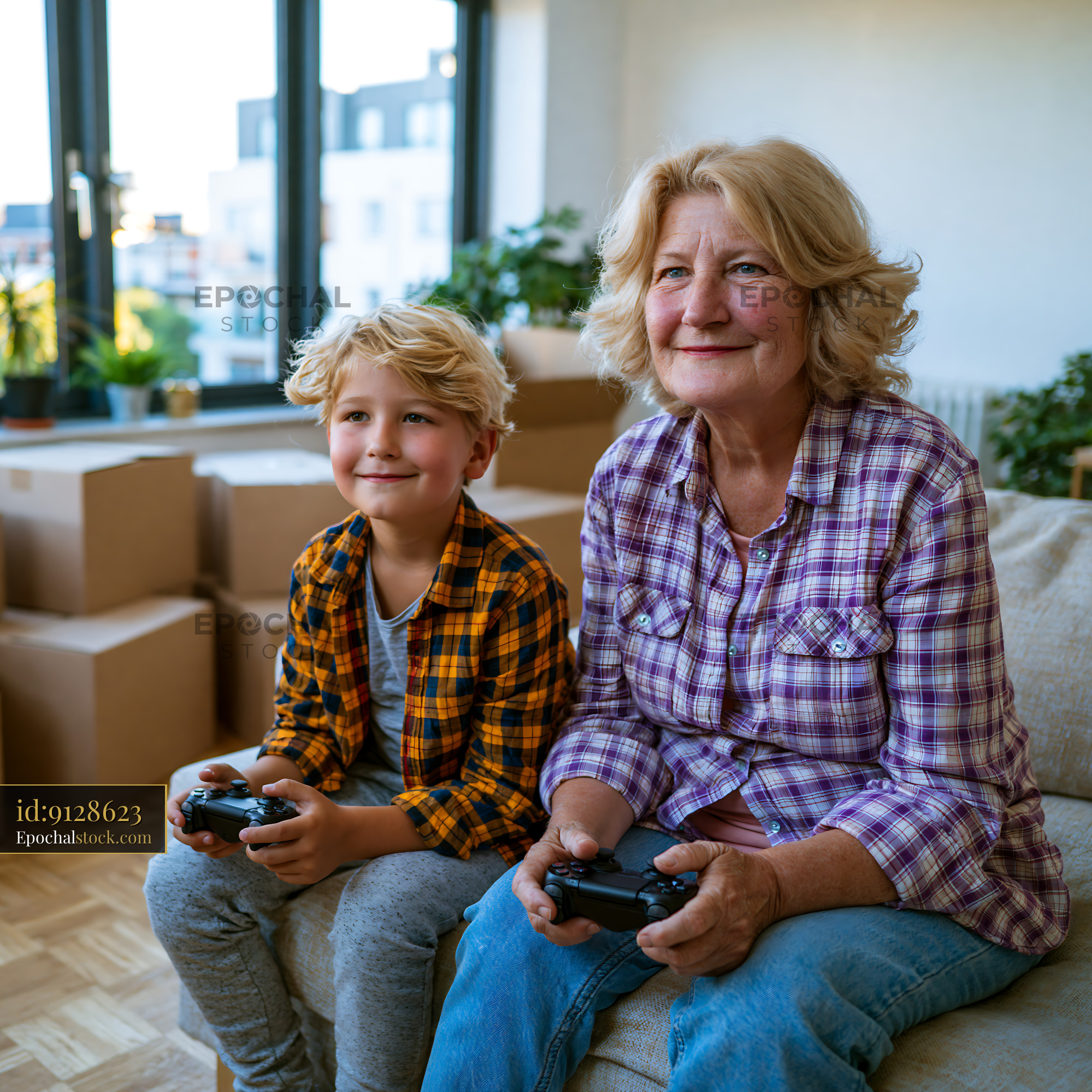 Watermarked full-resolution preview of Senior woman and boy play video games indoors
