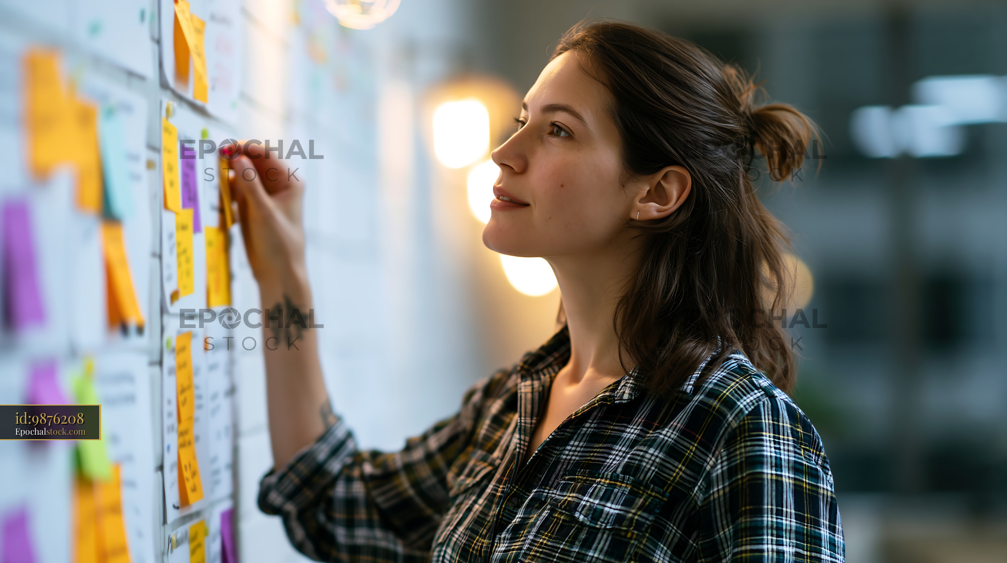 Manager Coordinating Tasks in Modern Office Space - stock photo