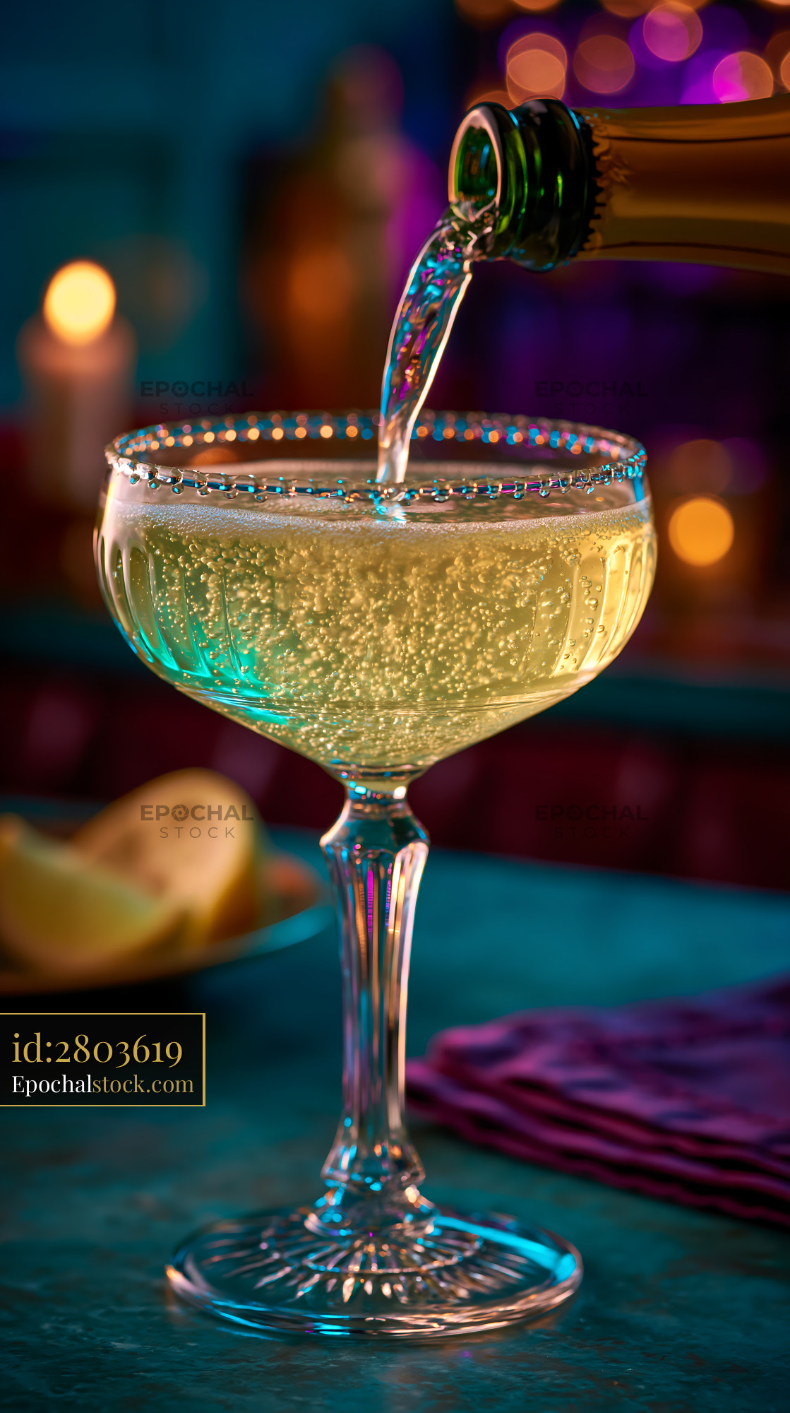 Watermarked full-resolution preview of Sparkling drink being poured into a glass in a bar setting