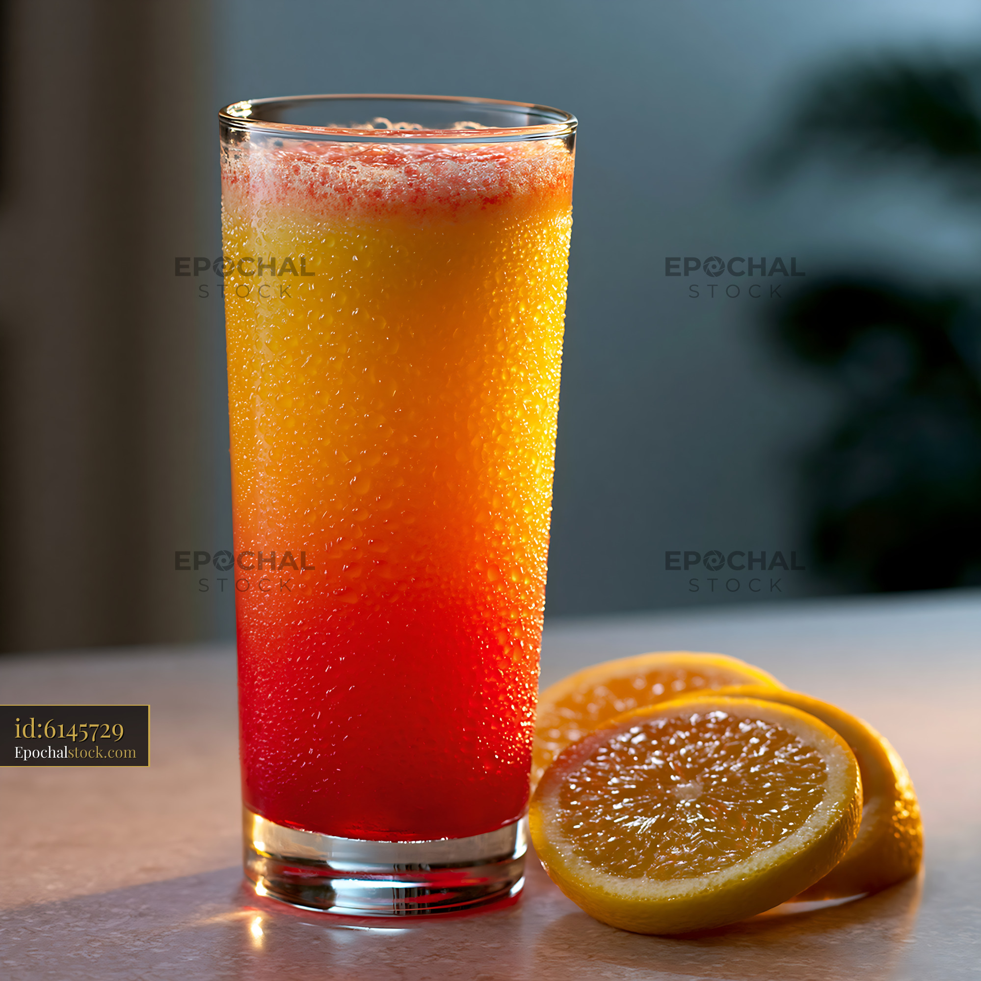 Watermarked full-resolution preview of Colorful citrus beverage in a chilled glass