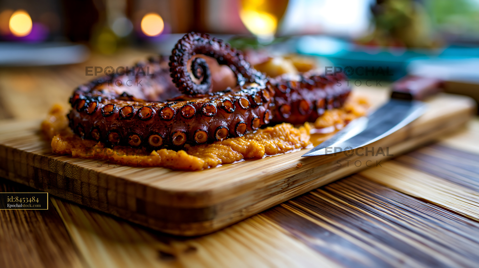 Watermarked full-resolution preview of Close-up grilled octopus on a wooden serving board