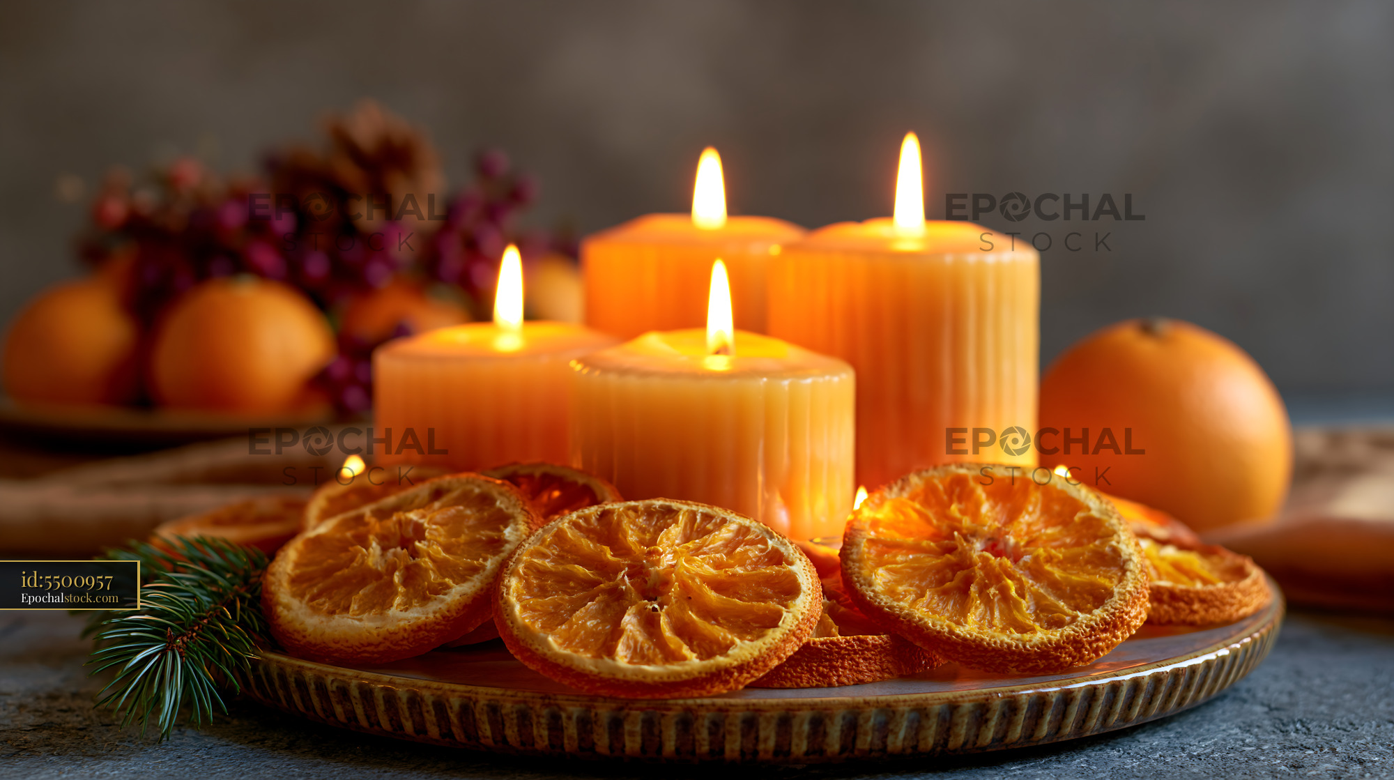 Watermarked full-resolution preview of Decorative candles with dried oranges on a table