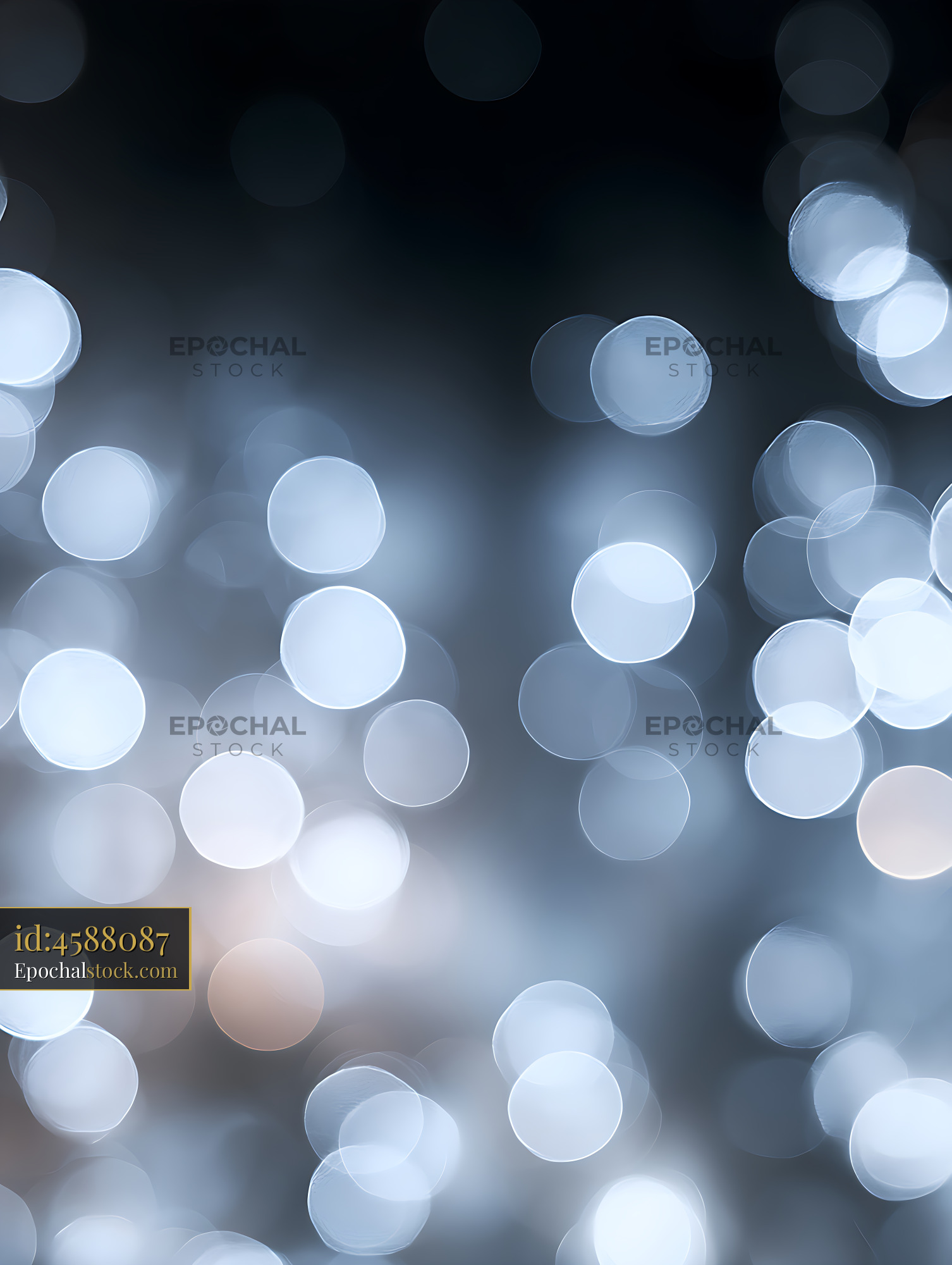 Watermarked full-resolution preview of Soft glowing bokeh circles on a dark blue background