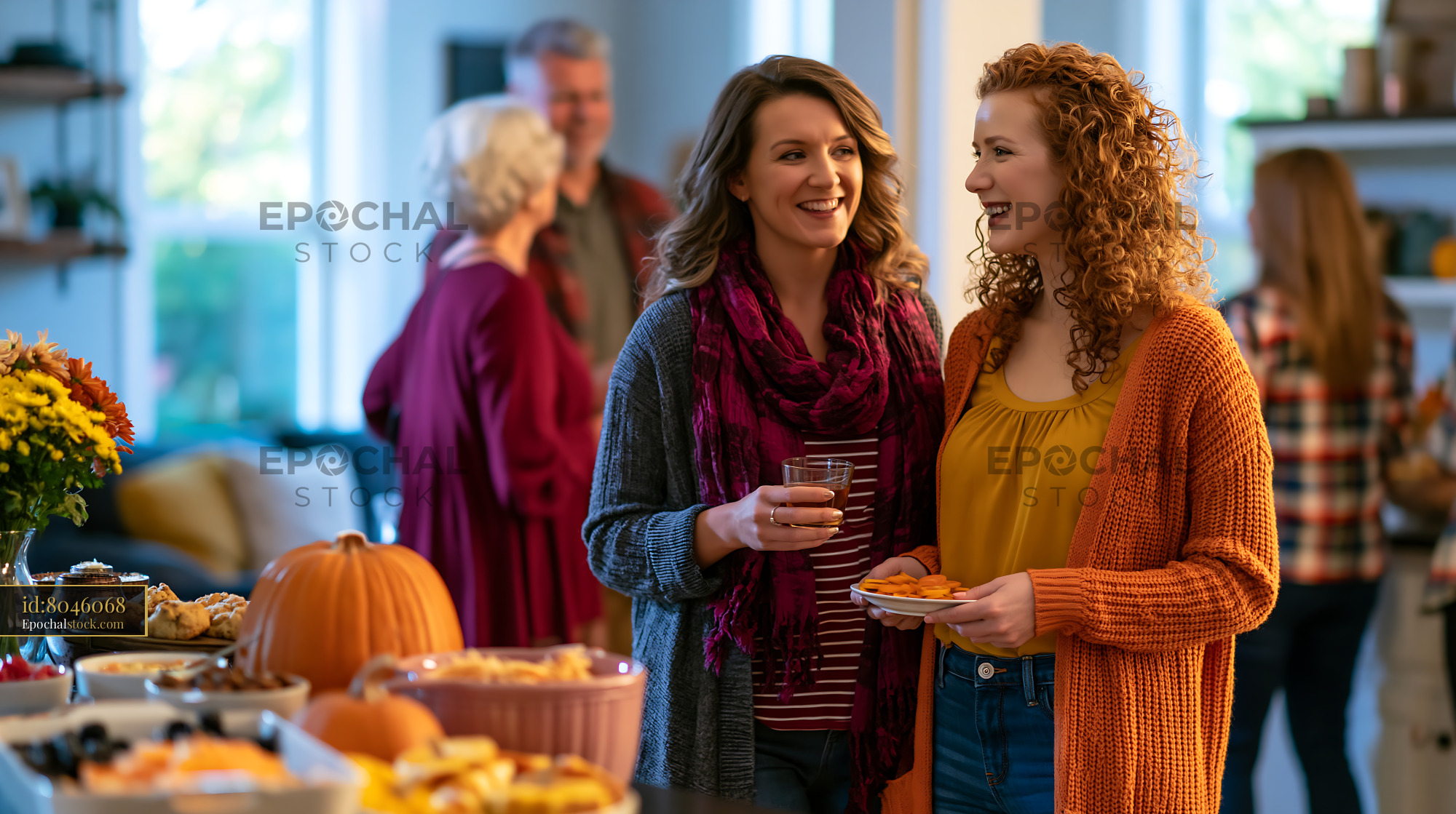 Watermarked full-resolution preview of Friends enjoying food and drinks at a festive gathering