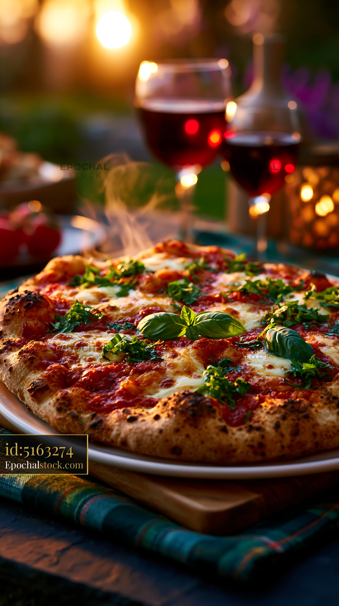 Watermarked full-resolution preview of Margherita pizza and red wine in warm evening light