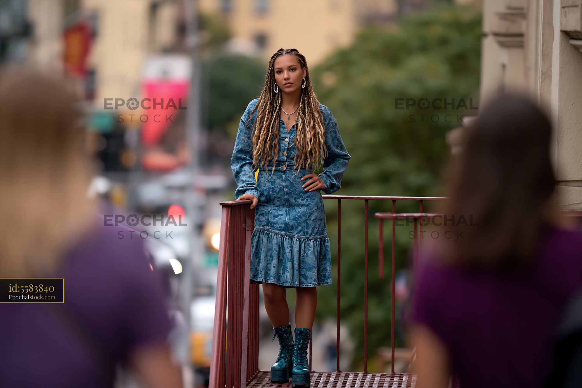Watermarked full-resolution preview of Fashion portrait of woman on a city footbridge