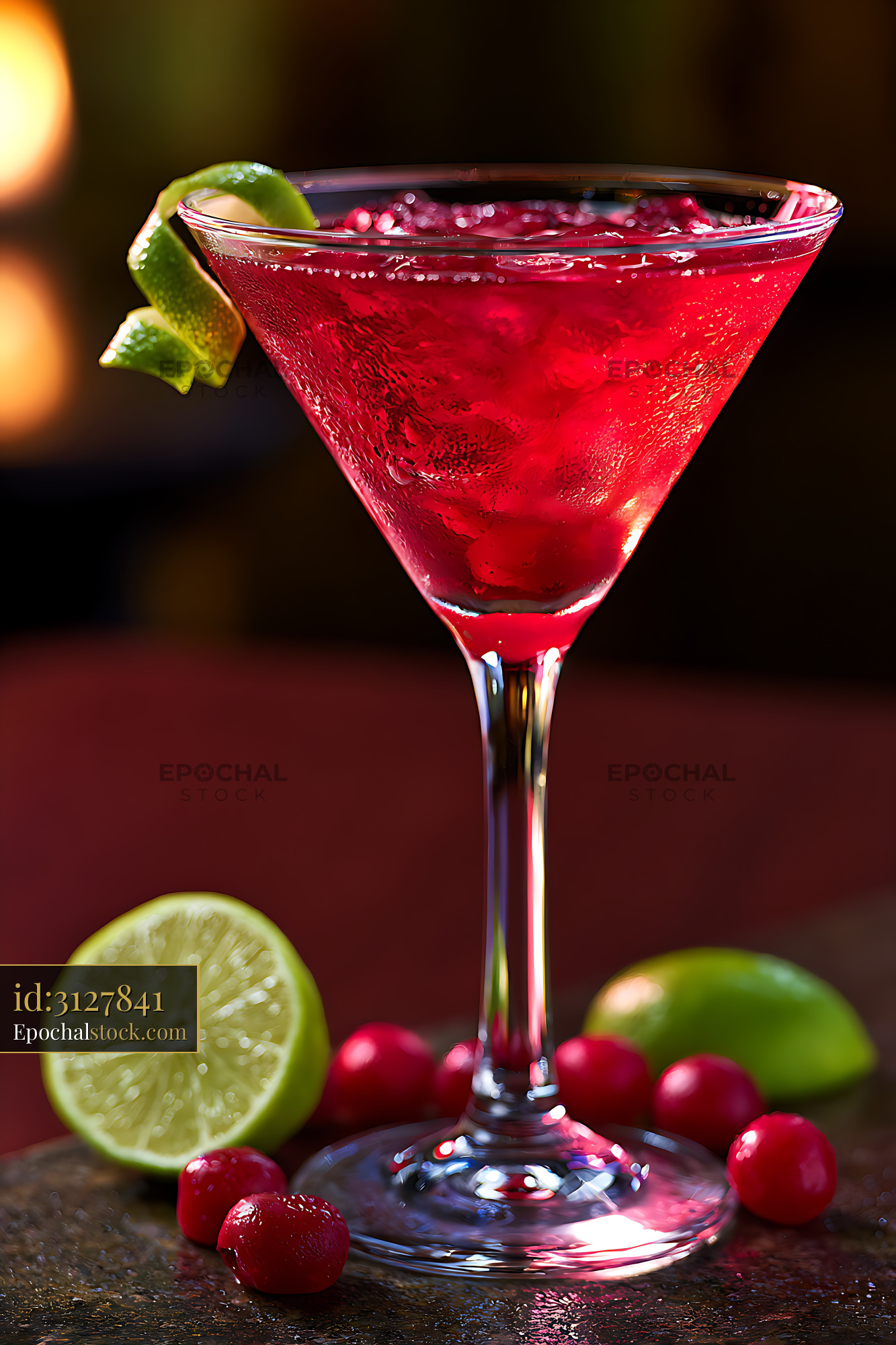 Watermarked full-resolution preview of Bright red cocktail with lime garnish and cranberries