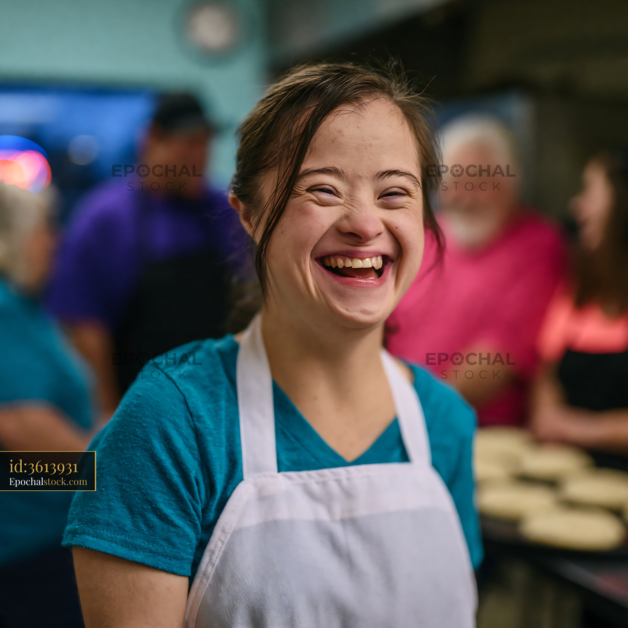 Watermarked full-resolution preview of Smiling person working in a kitchen setting with diverse group