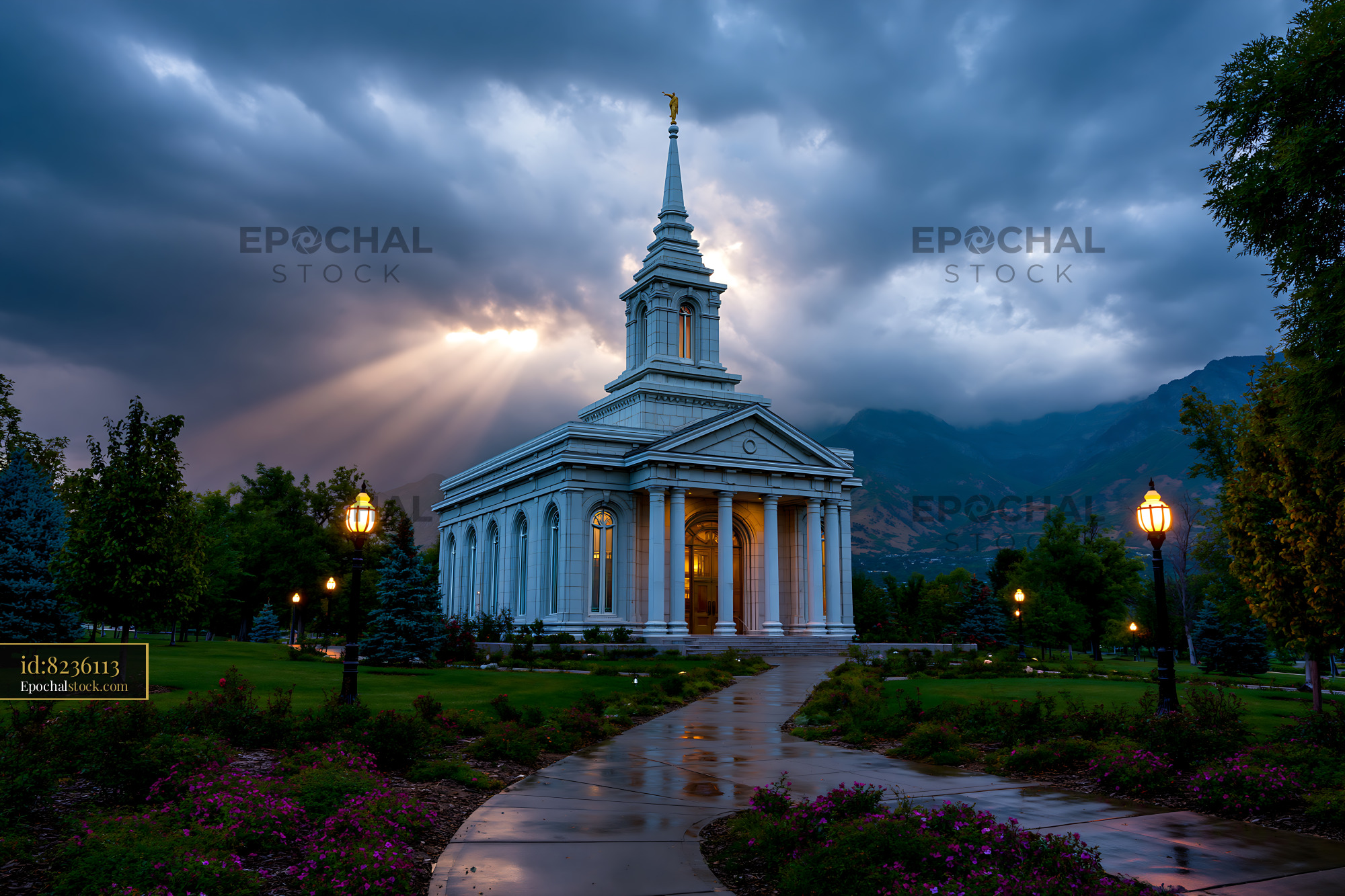 Watermarked full-resolution preview of Historic building under cloudy sky with sunlight breaking through