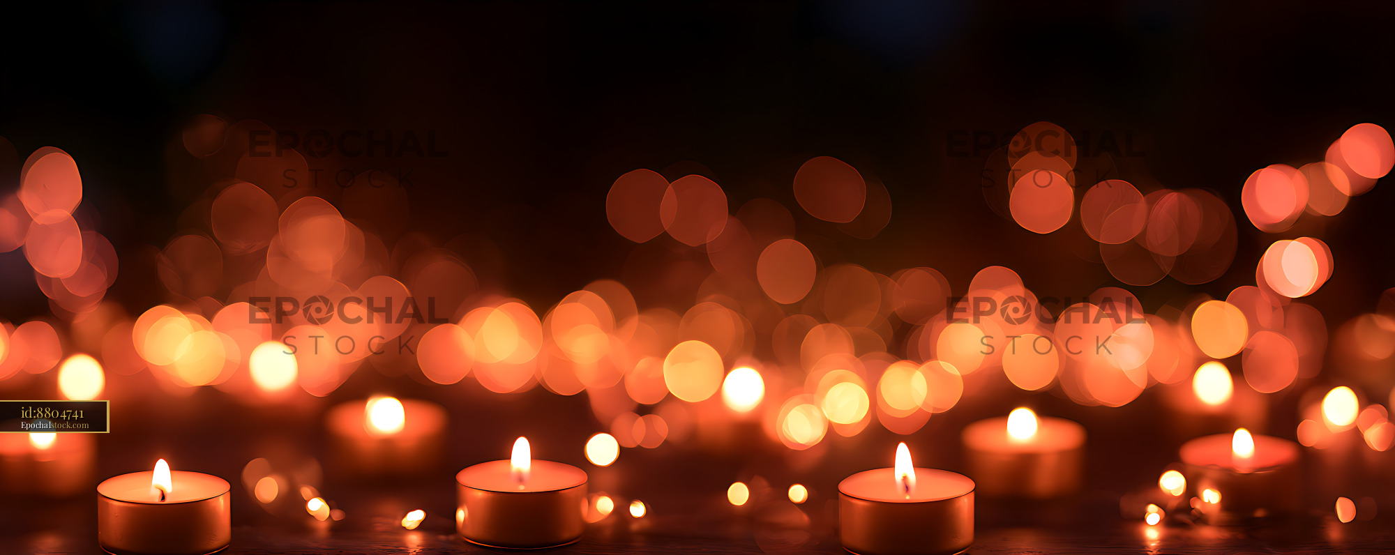 Watermarked full-resolution preview of Warm glowing candles and orange bokeh lights