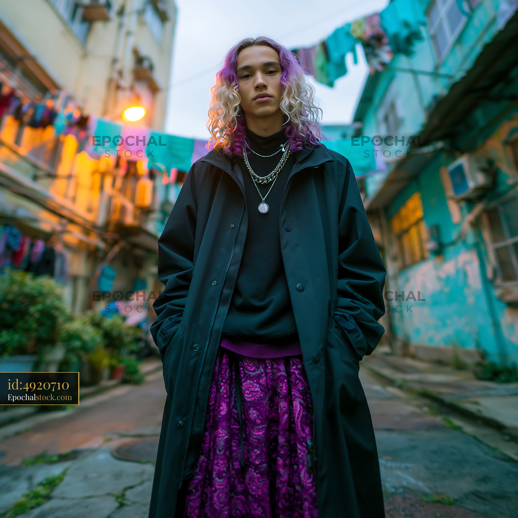 Watermarked full-resolution preview of Young adult in black coat and purple patterned skirt
