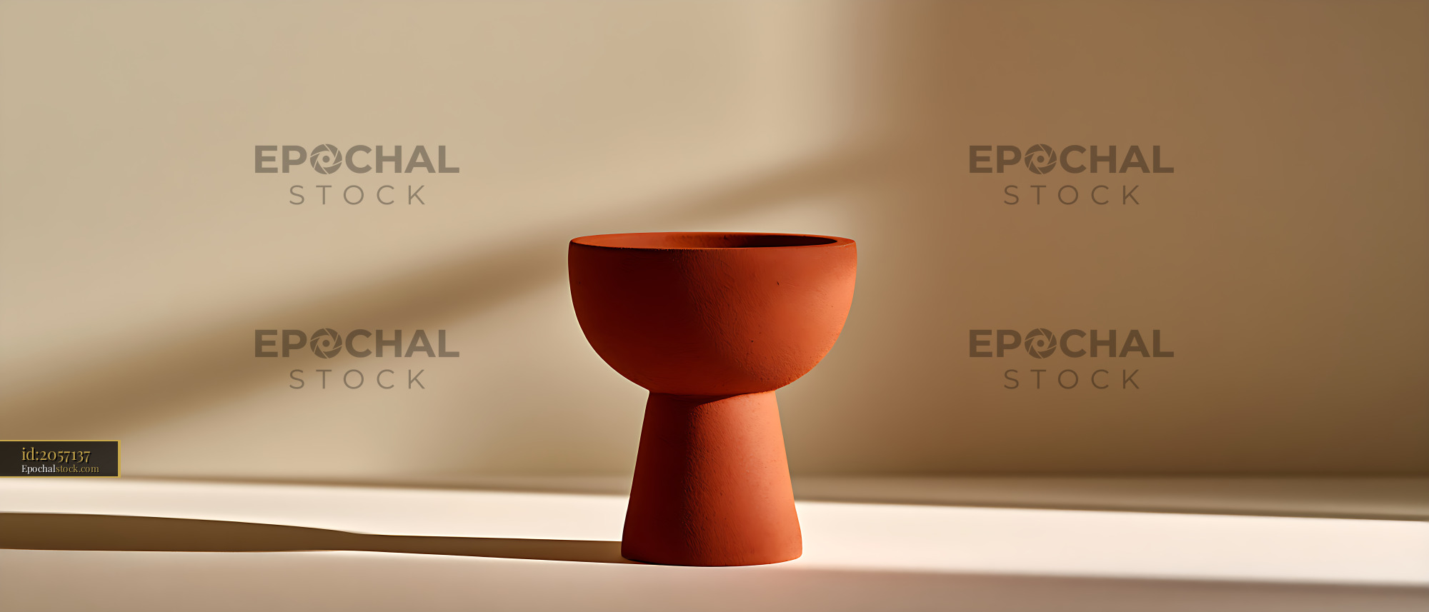 Watermarked full-resolution preview of Minimal terracotta vessel with a long sunlit shadow