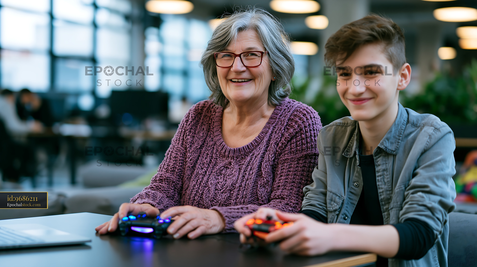 Older Woman and Grandson Enjoying Video Games Together - stock photo