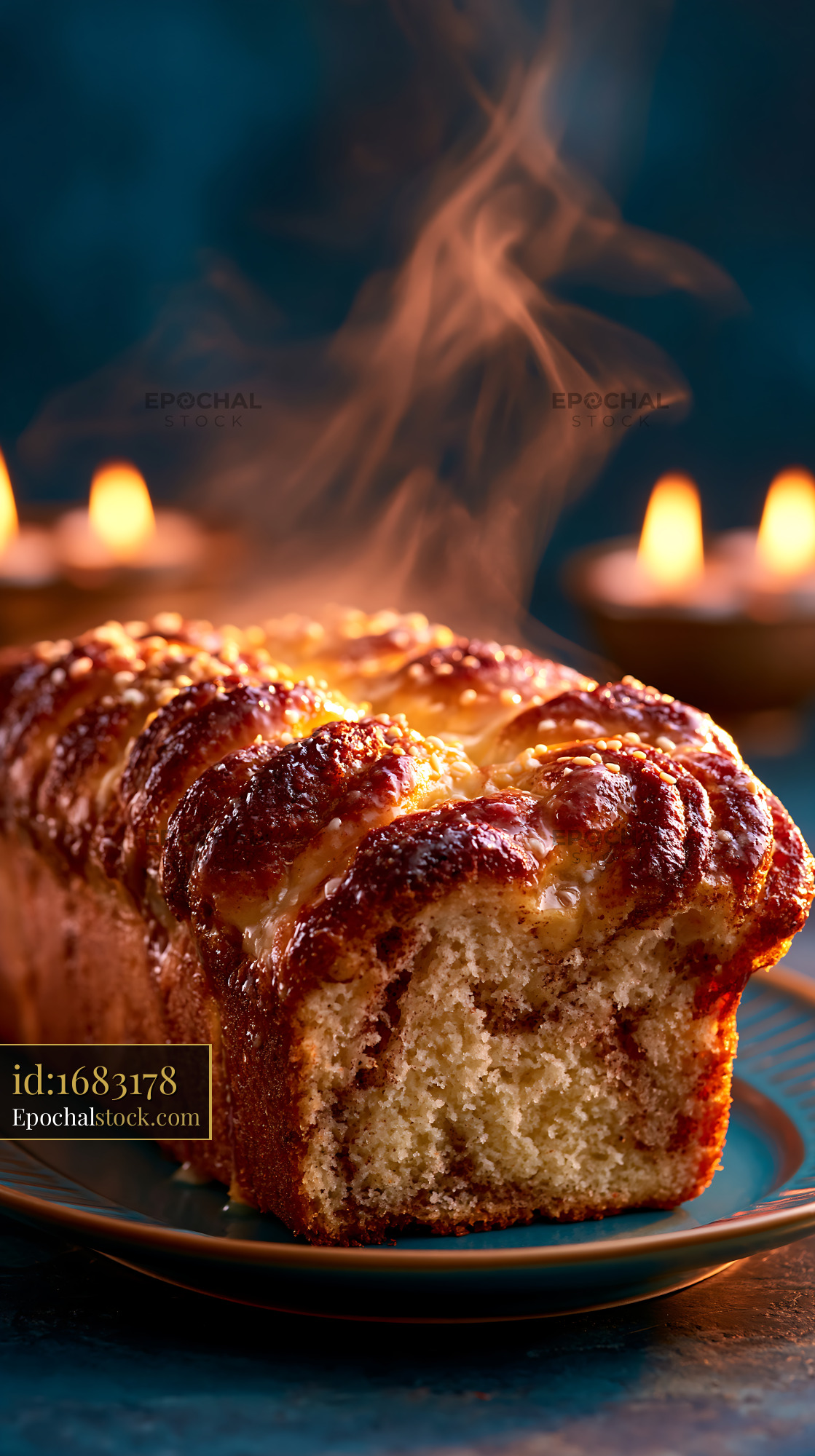 Watermarked full-resolution preview of Freshly baked loaf of bread with steam rising in dim light