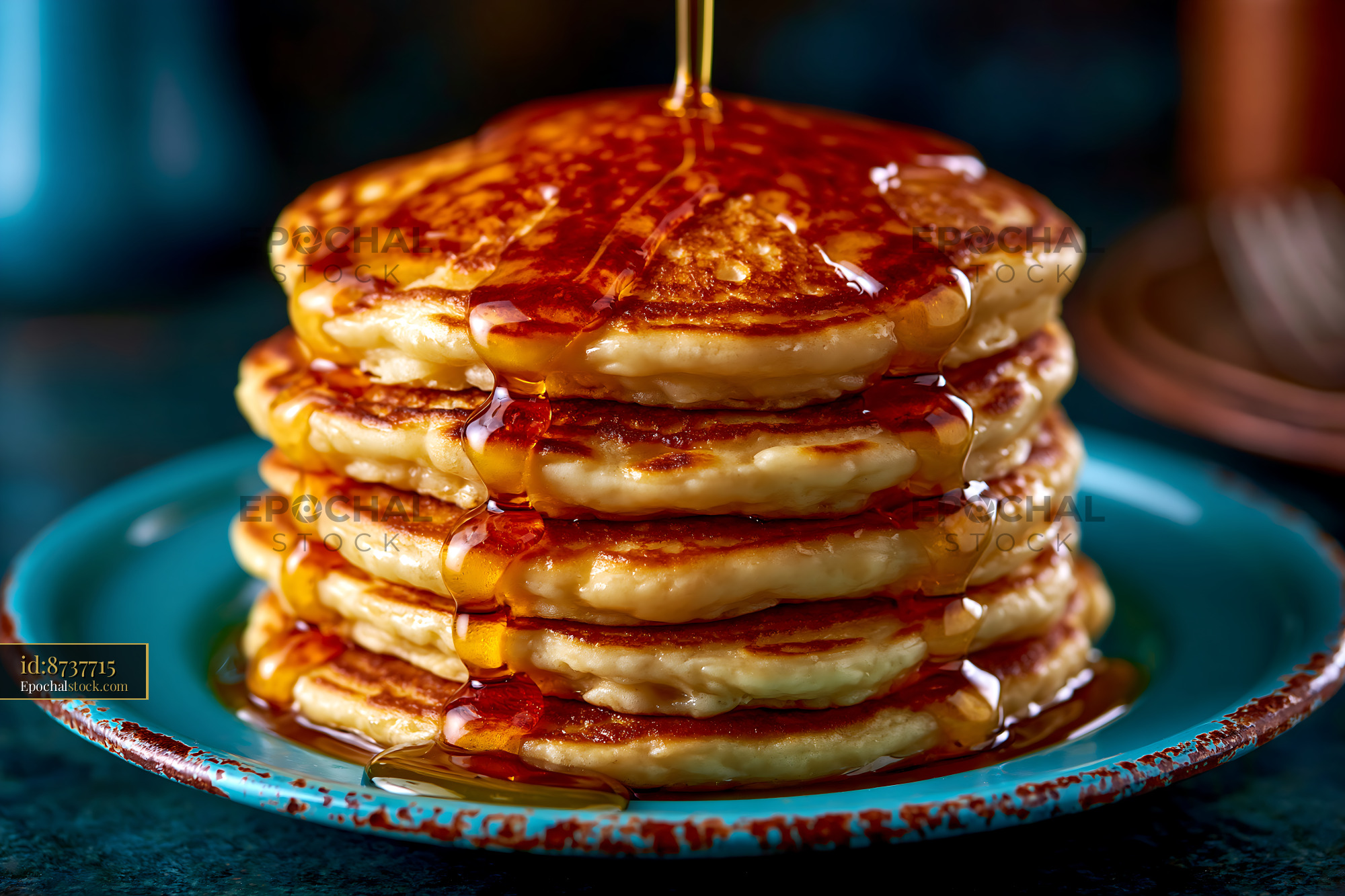 Watermarked full-resolution preview of Fluffy pancakes stacked on a plate with syrup pouring down