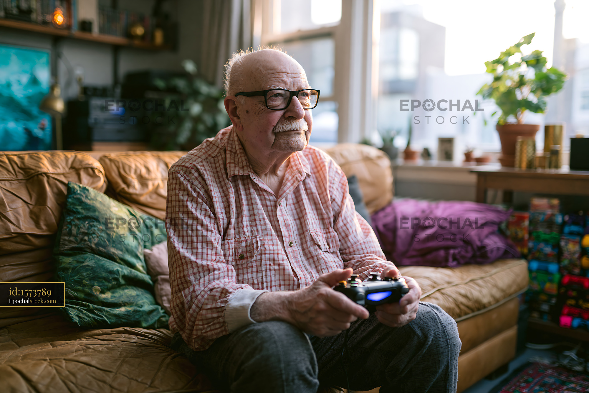 Watermarked full-resolution preview of Older man gaming in a comfortable living room