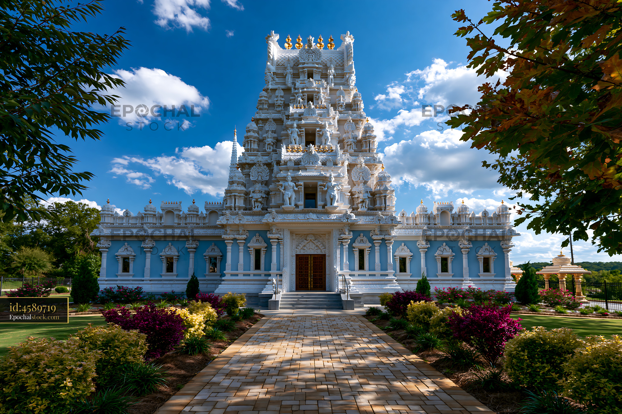 Watermarked full-resolution preview of Colorful temple under a blue sky with fluffy clouds