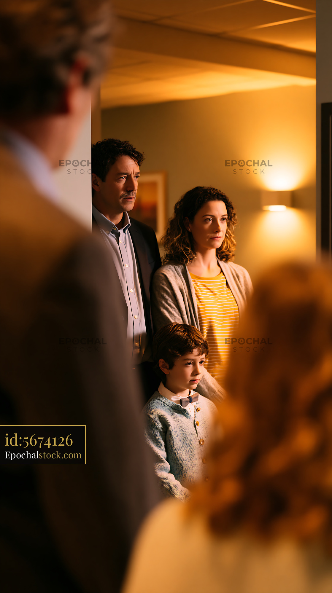 Watermarked full-resolution preview of Family gathering in a cozy indoor setting