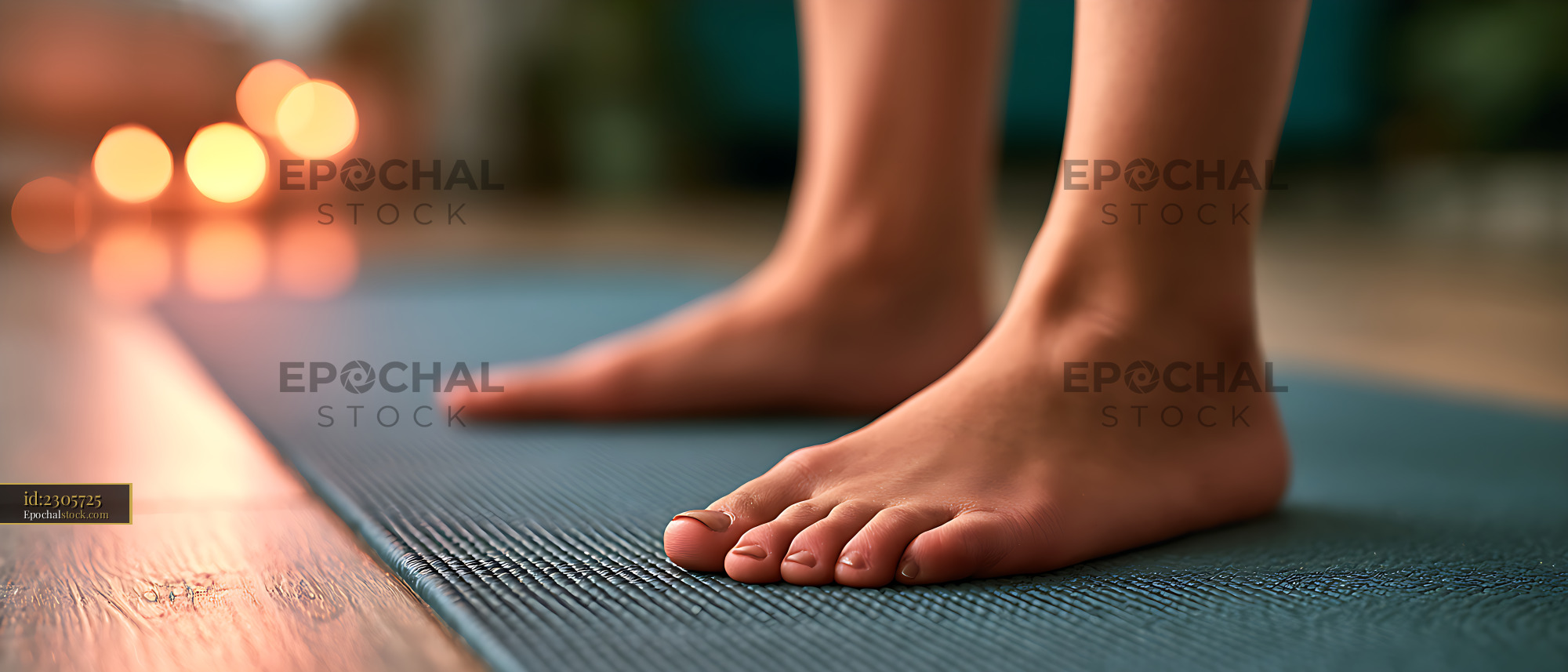 Watermarked full-resolution preview of Close-up of bare feet on an exercise mat
