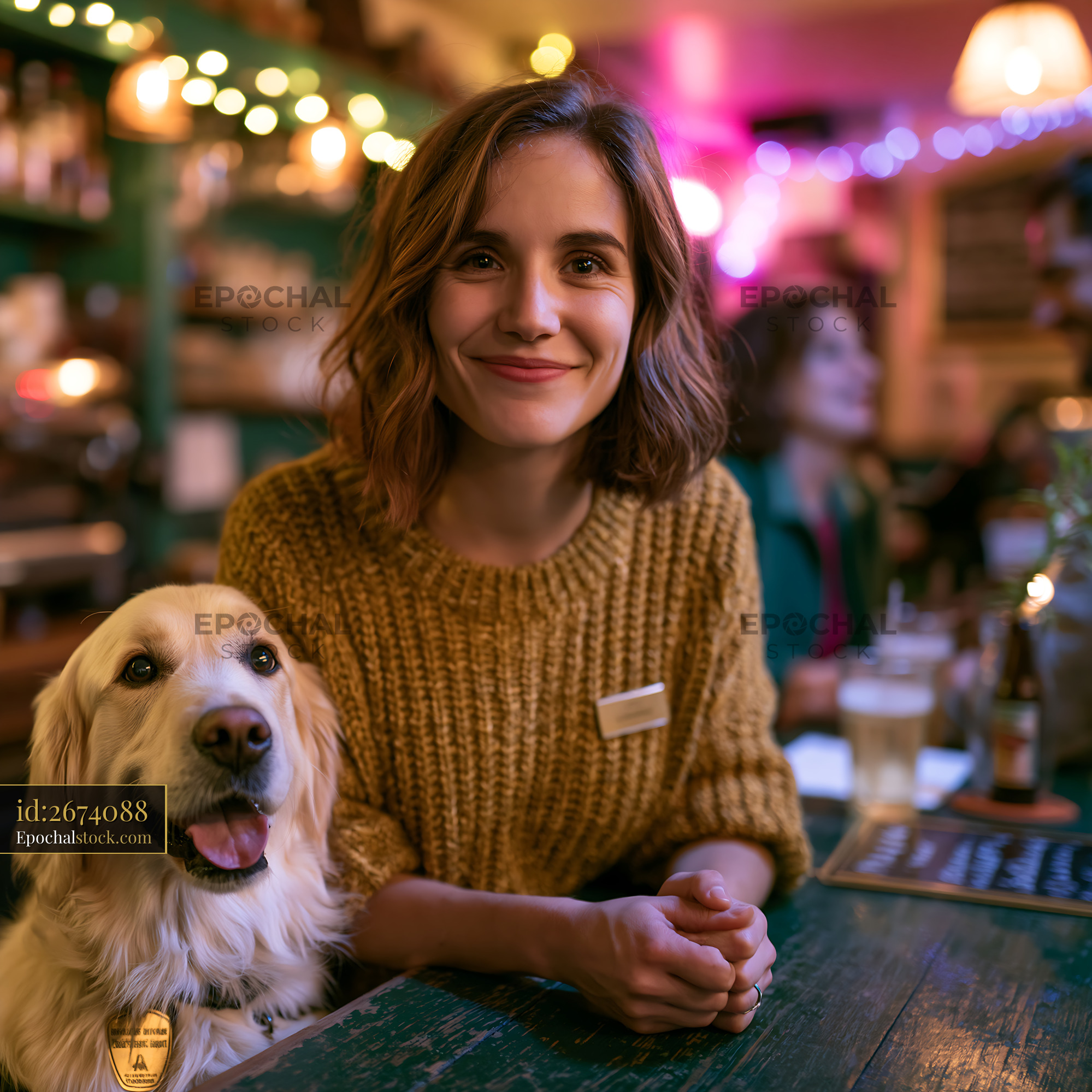 Watermarked full-resolution preview of Woman sitting in cafe with dog during evening hours