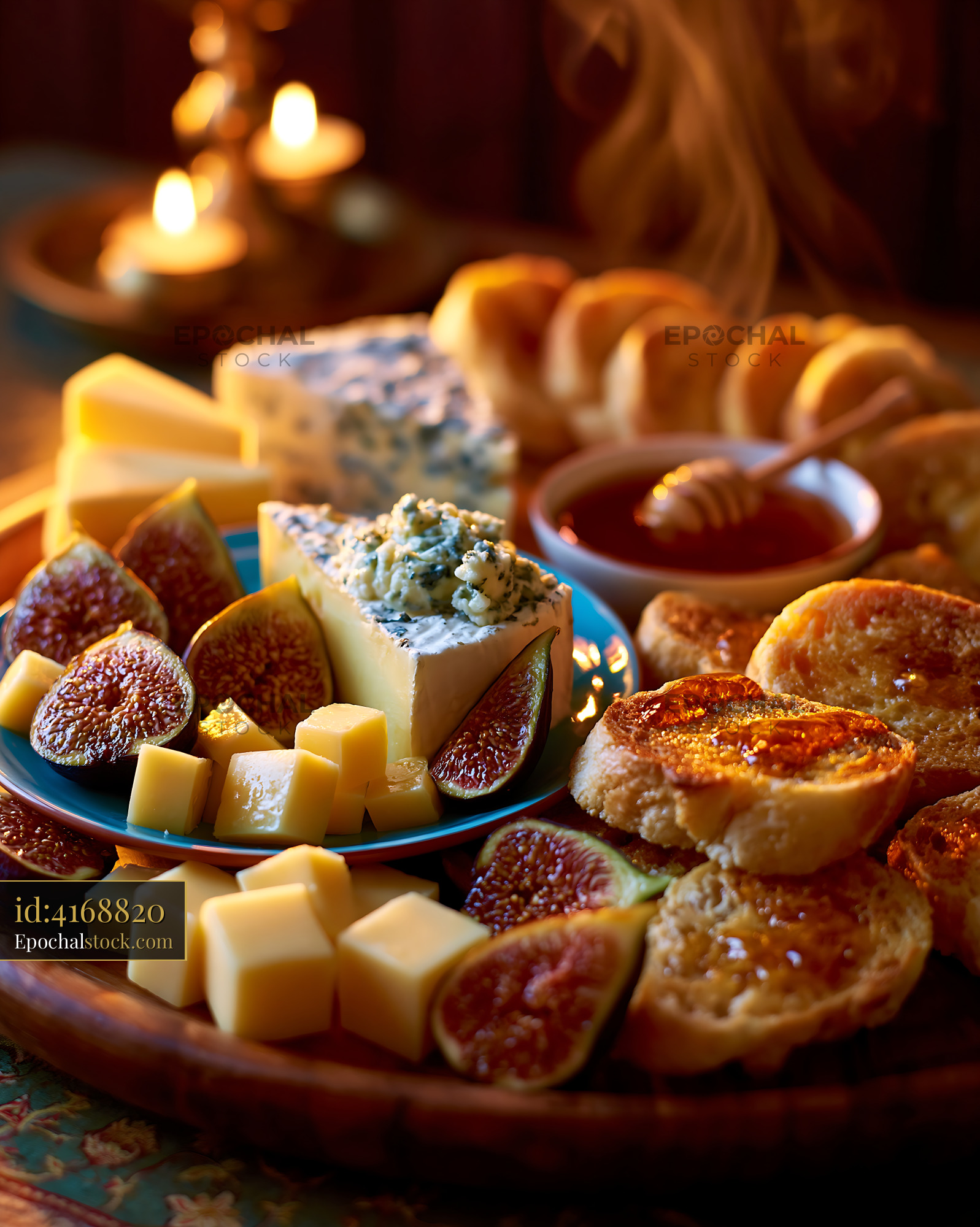Watermarked full-resolution preview of Cheese platter with figs and bread arranged on wooden table