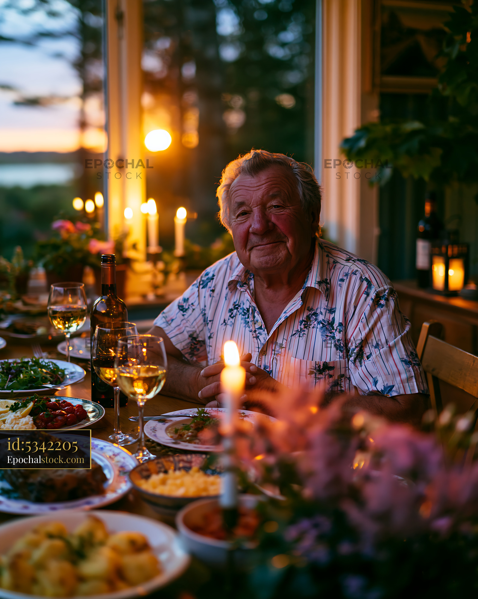 Watermarked full-resolution preview of Dinner gathering at sunset with an older man and various dishes