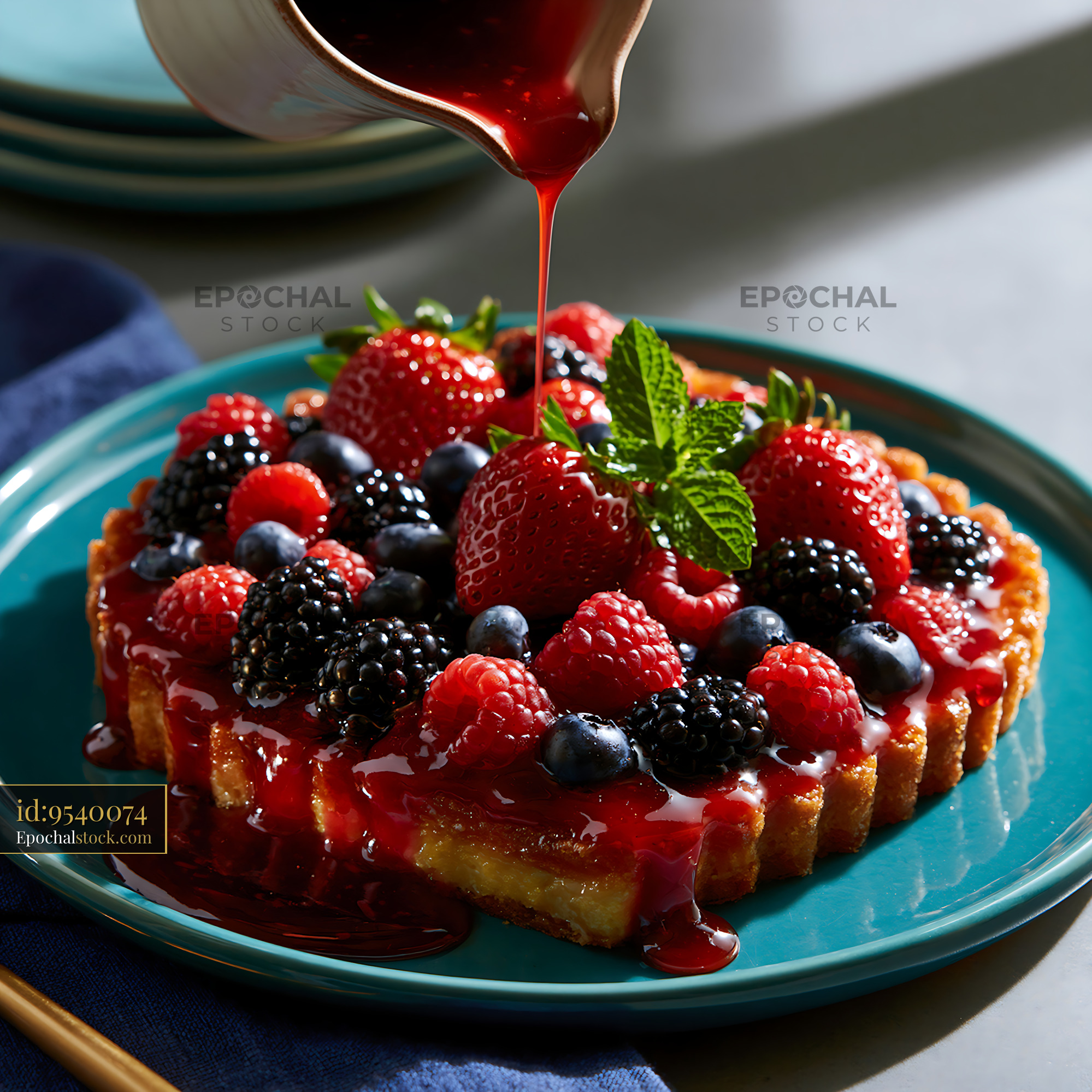 Watermarked full-resolution preview of Fresh berry tart with sauce being poured on top