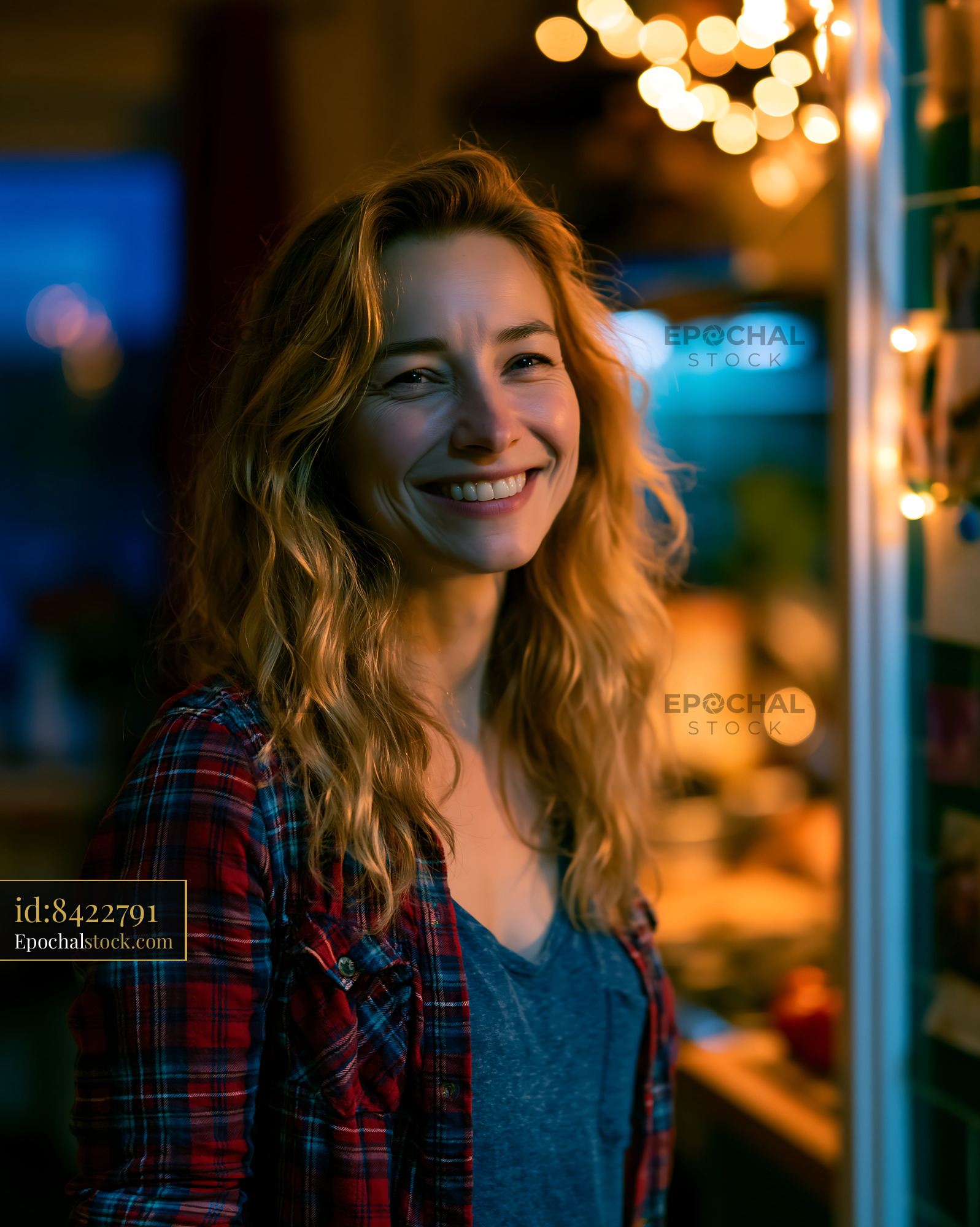 Watermarked full-resolution preview of Smiling woman in cozy indoor setting during evening