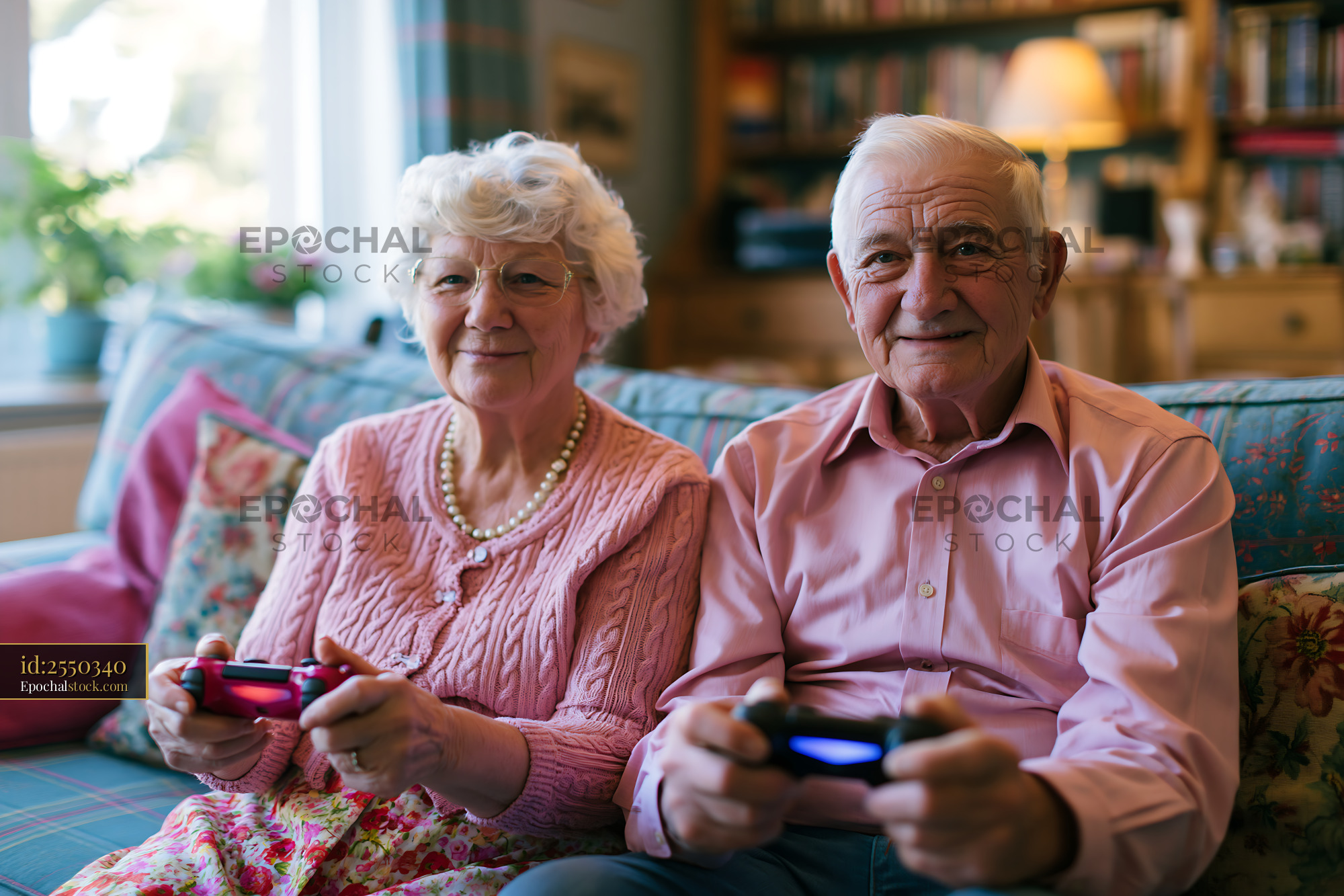 Elderly Couple Playing Video Games in Cozy Living Room - stock photo