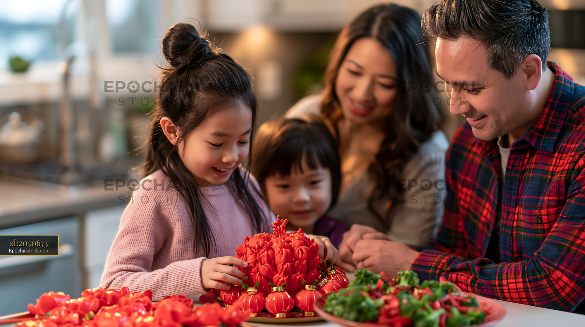 Watermarked full-resolution preview of Family preparing food with small tomatoes in the kitchen