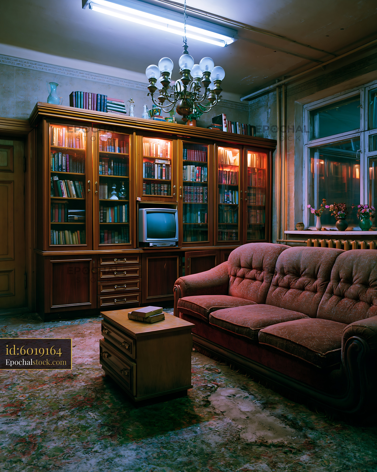 Watermarked full-resolution preview of Cozy living room with bookshelves and vintage furniture