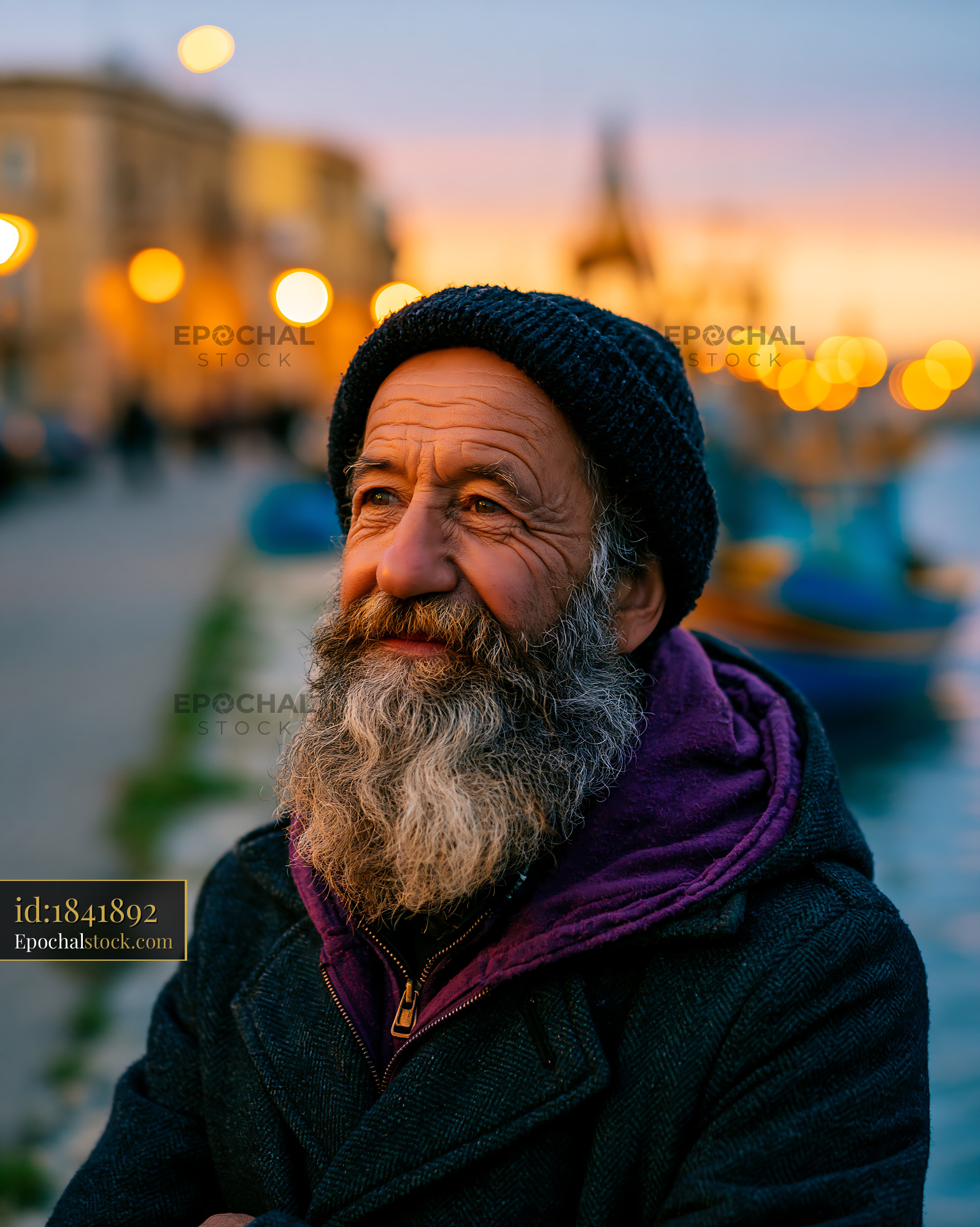 Watermarked full-resolution preview of Man with beard standing near water at sunset