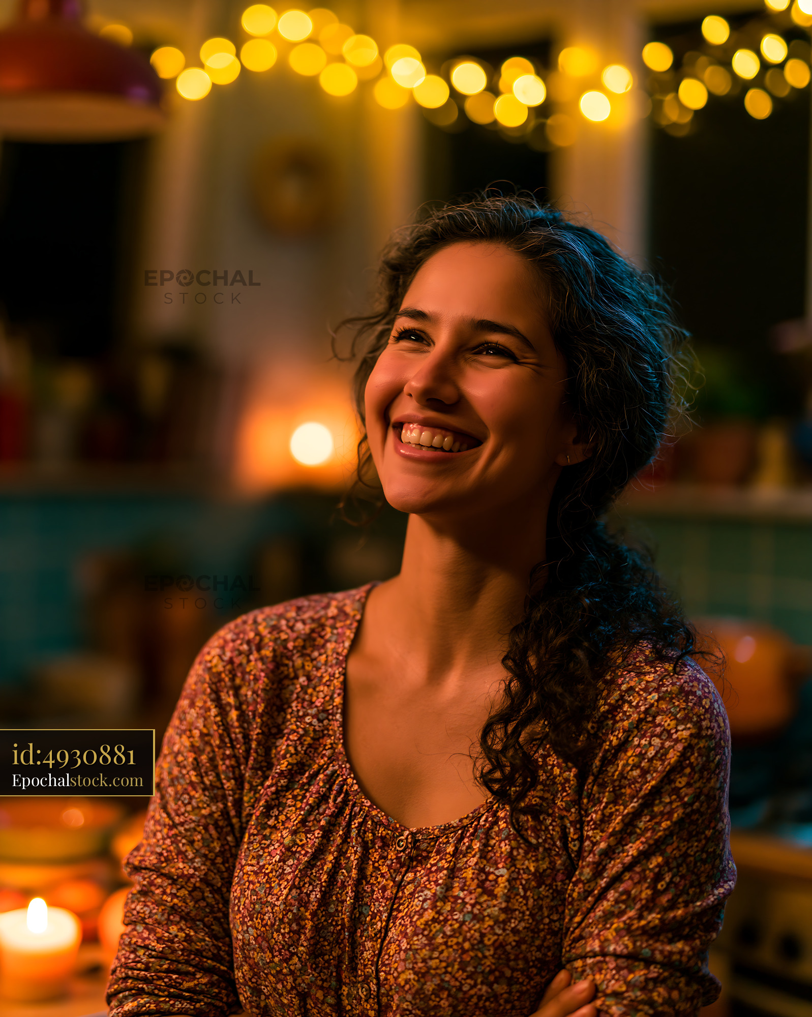 Watermarked full-resolution preview of Woman smiling in cozy kitchen with warm lights during evening