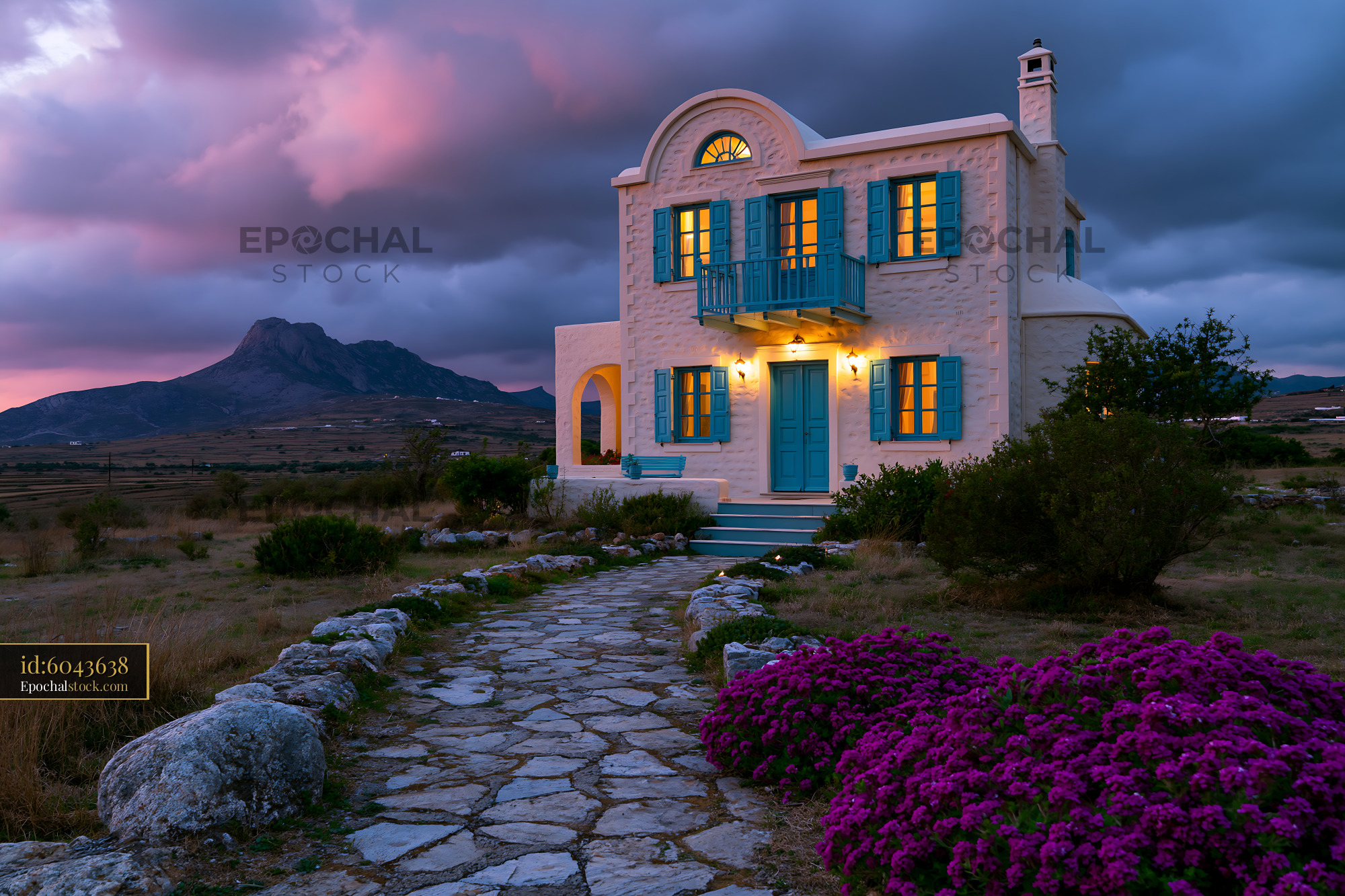Watermarked full-resolution preview of Charming house with blue shutters near mountain landscape