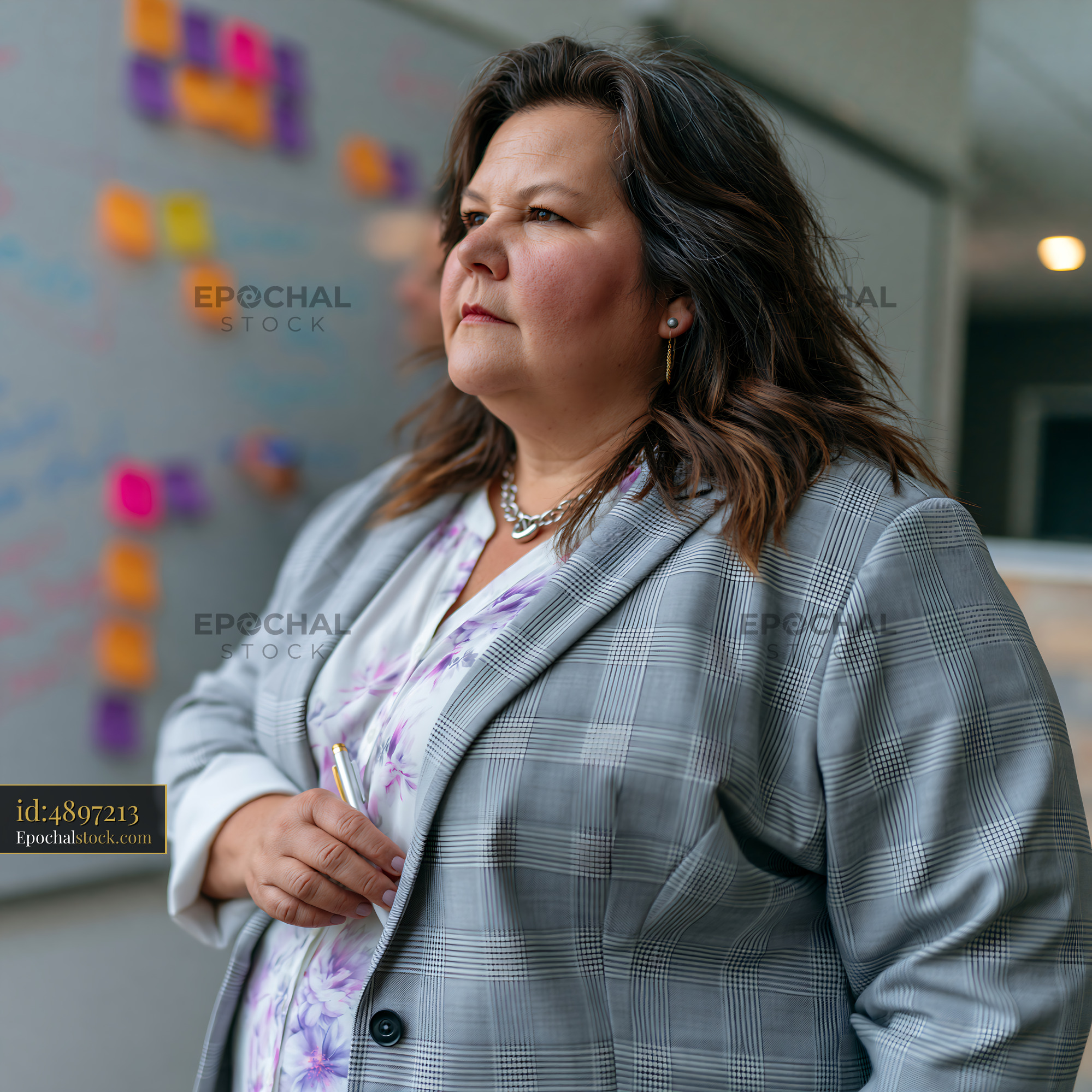 Plus Size Businesswoman in Tailored Suit During Office Meeting - stock photo